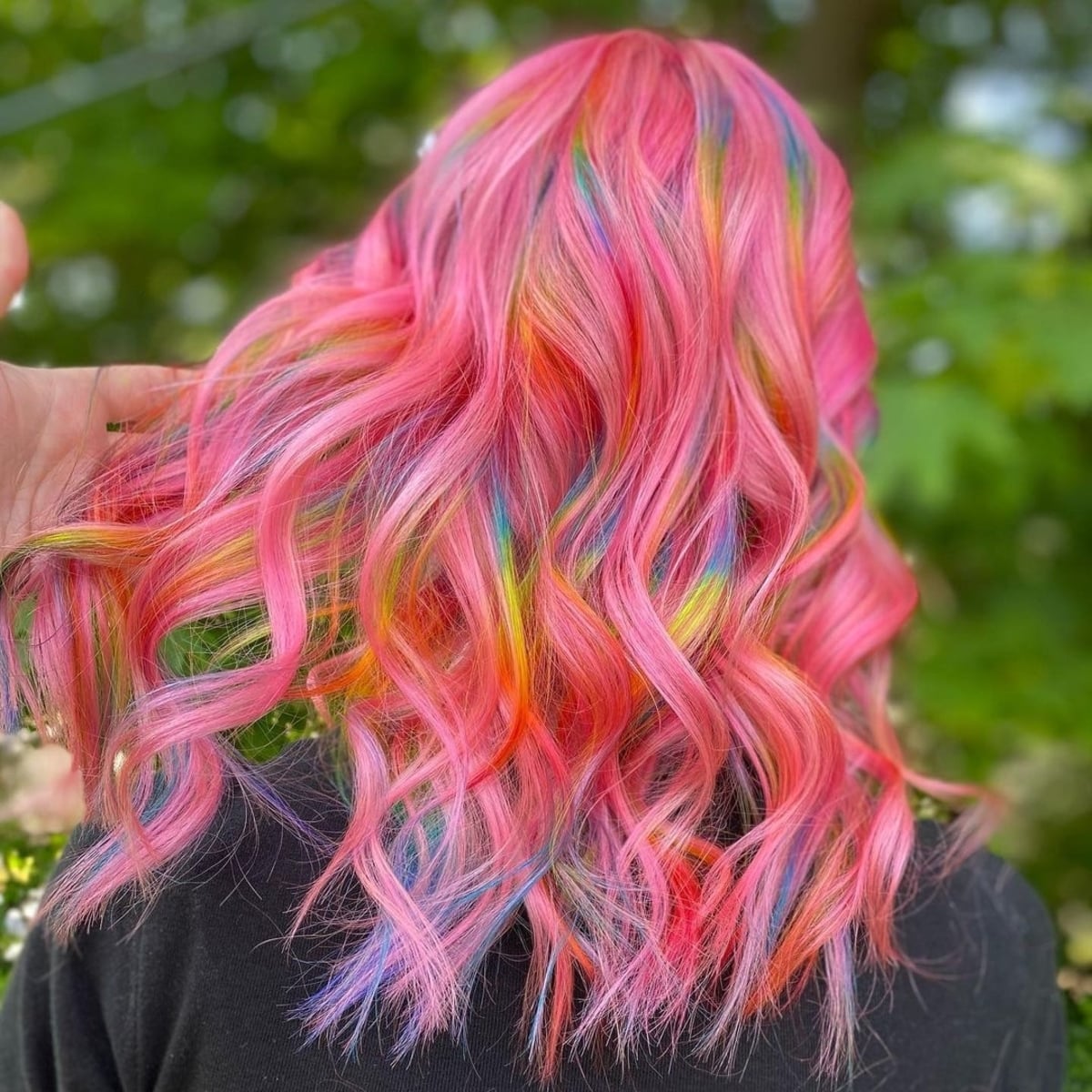 Hints of rainbow on pink hair