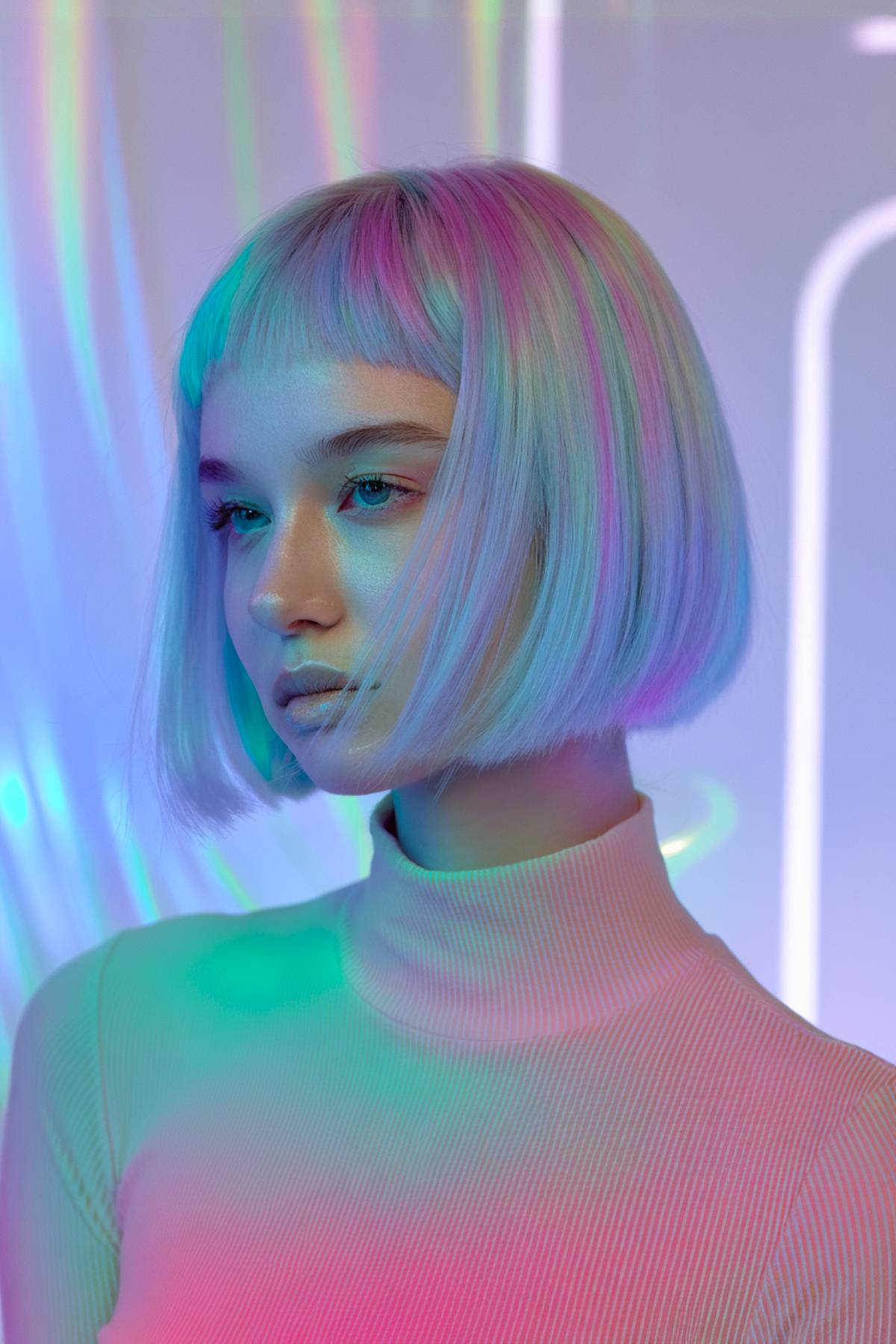 Hologem bob with a platinum base and holographic pastel highlights in pink, blue, and lavender