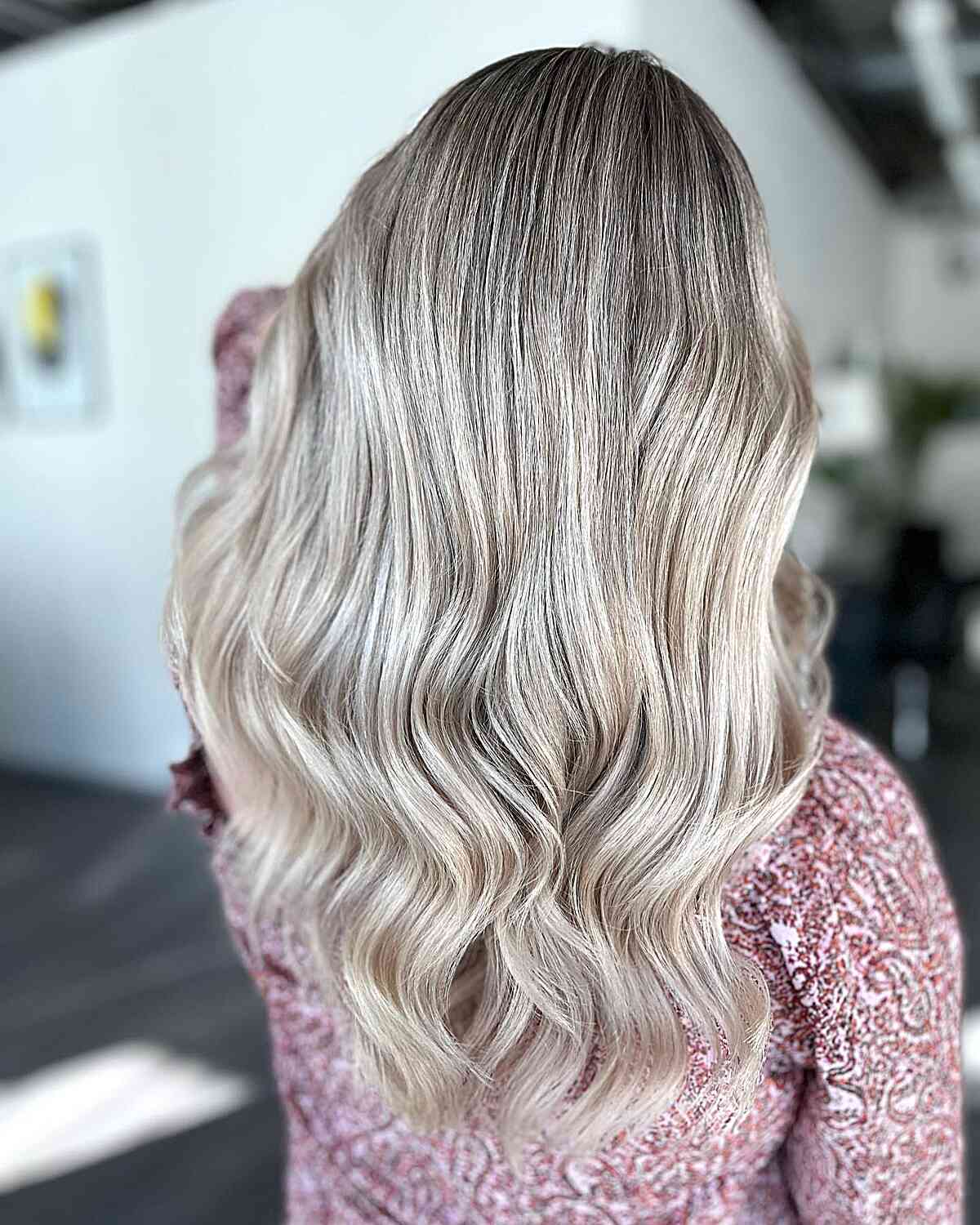 Ice White Blonde Balayage Babylights with Darker Roots for Long Wavy Hair
