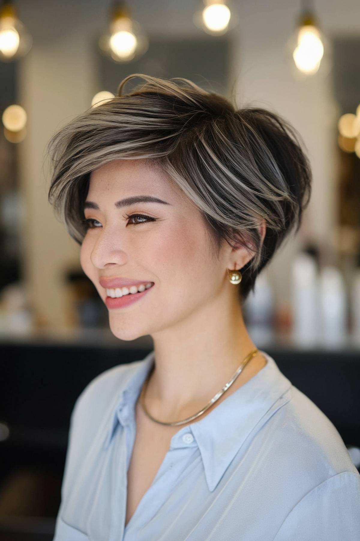 Short dark hair with icy blonde highlights for a striking, high-contrast effect