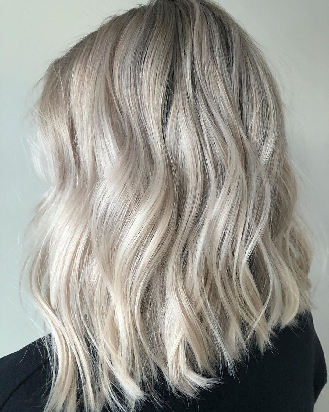 Icy Blonde on Medium-Length Hair with a Beach Wavy Style