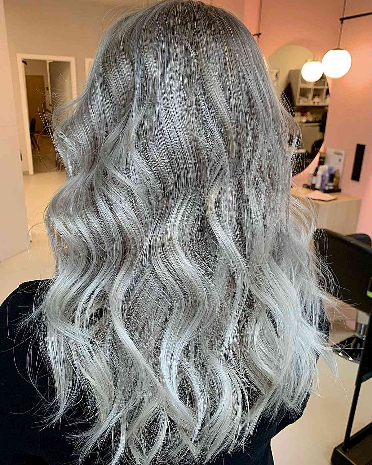 Ice Platinum Blonde Tones on Wavy Light Brown Hair with Airtouch Balayage Technique