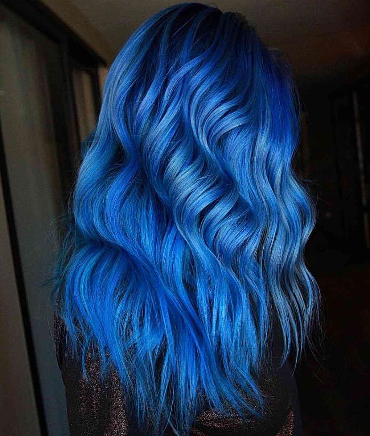 Icy Blue Balayage for ladies with vibrant, long wavy hair