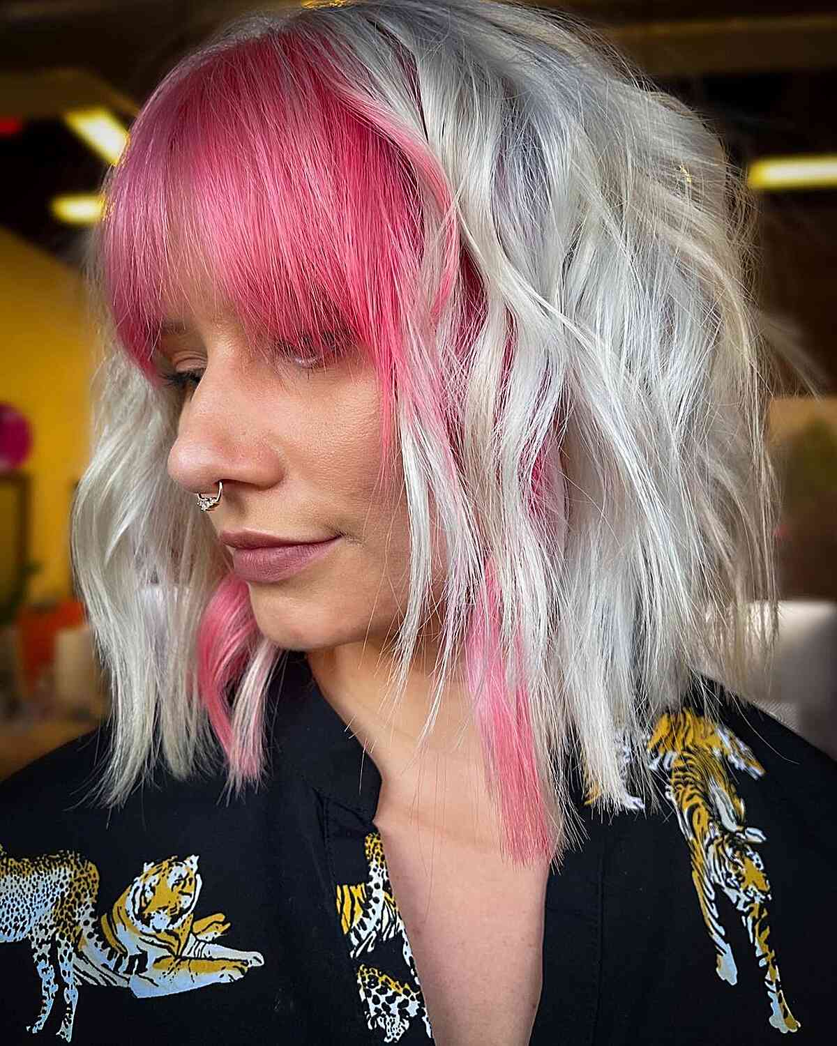 Icy White Blonde with Face-Framing Pink Bangs on women with shoulder-length hair