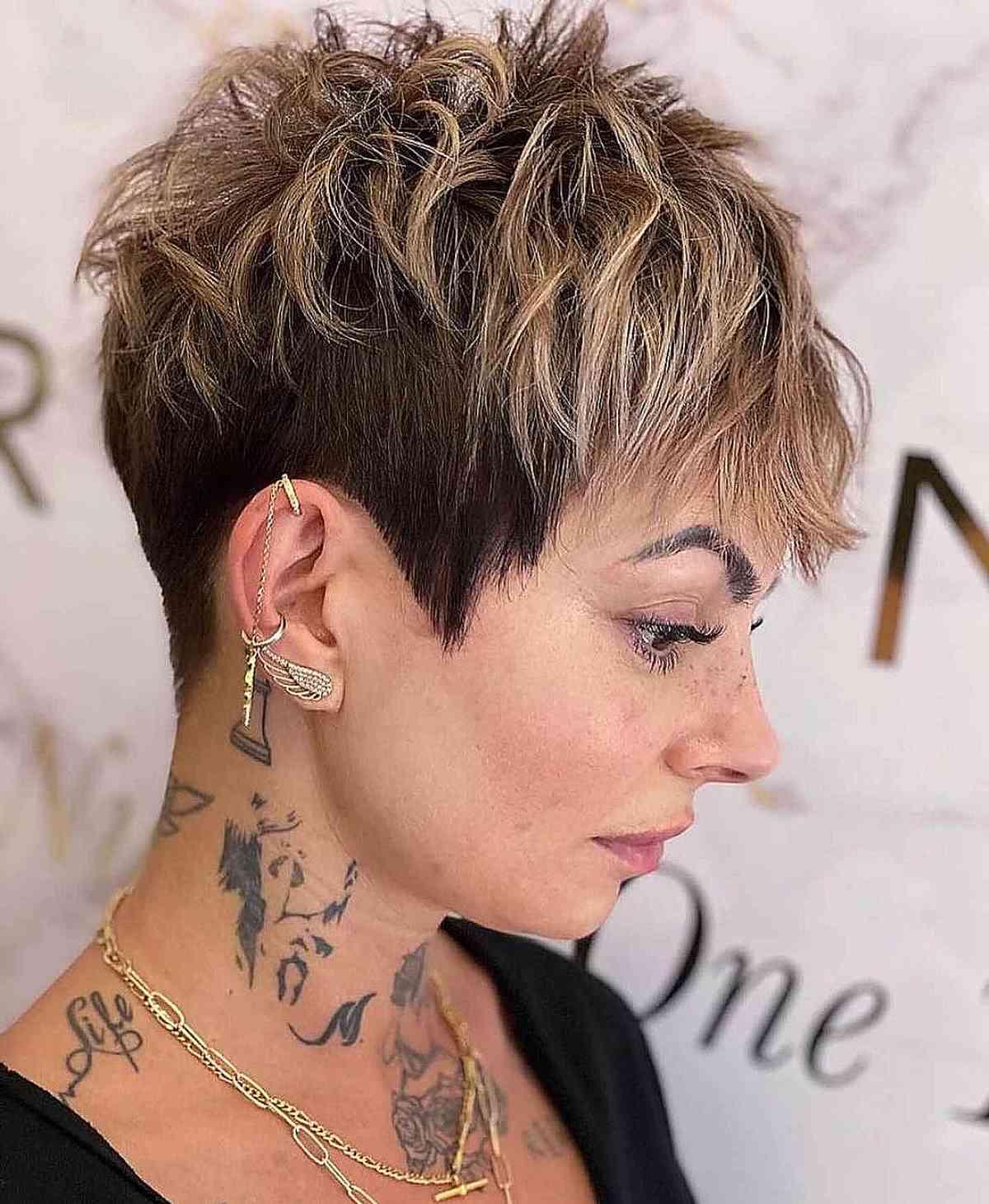 Edgy textured pixie haircut with blonde highlights and choppy layers inclusive hairstyle 