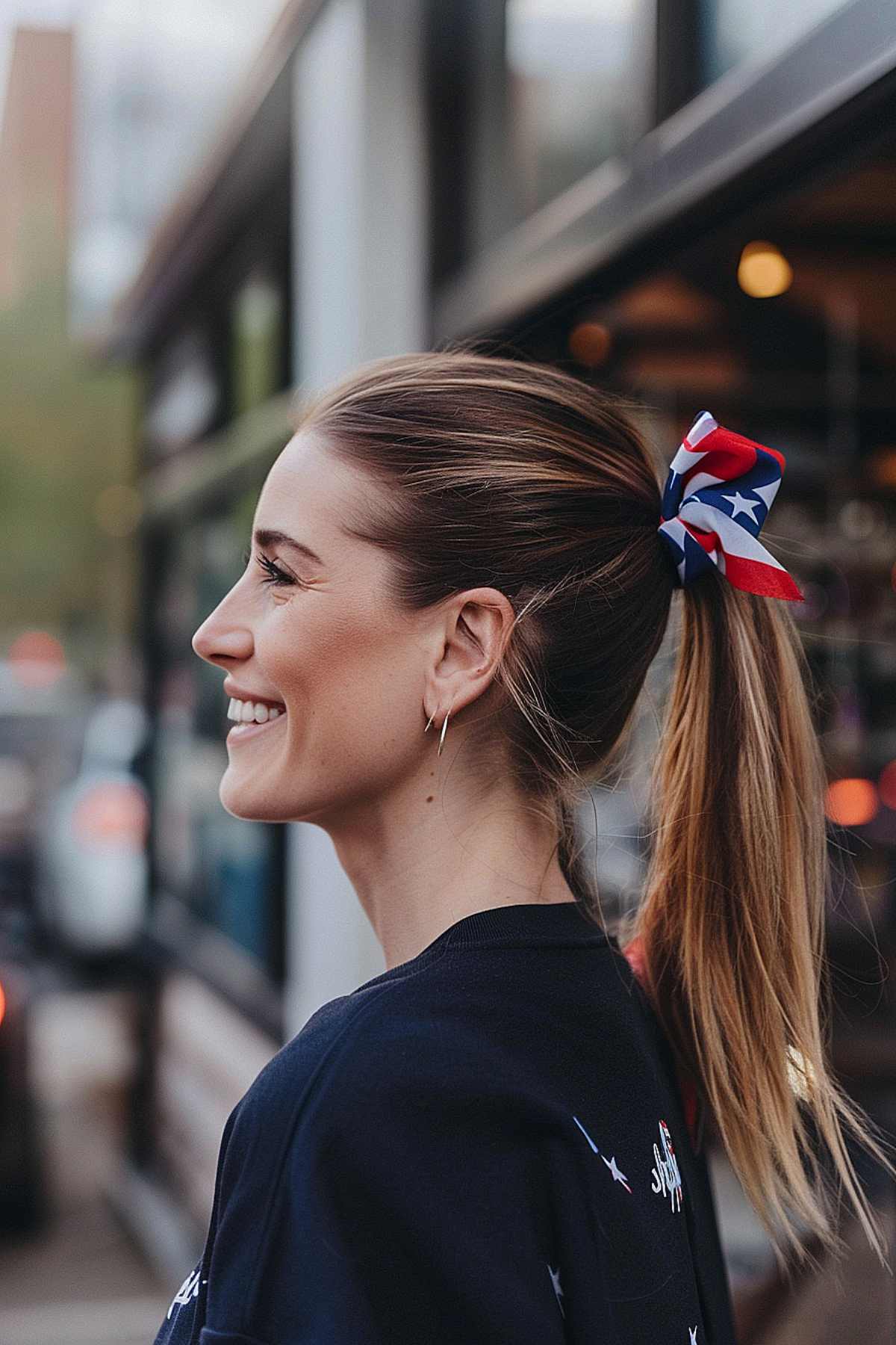 Mid-height ponytail with a patriotic bow for Independence Day