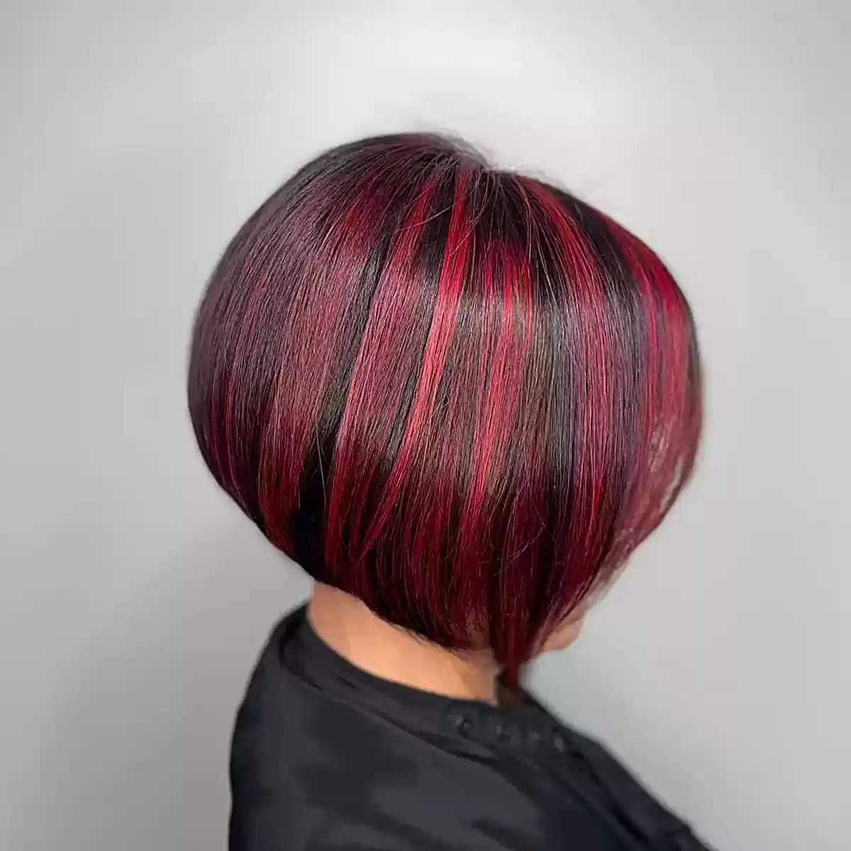 Stacked Inverted Bob with Vivid Red Highlights