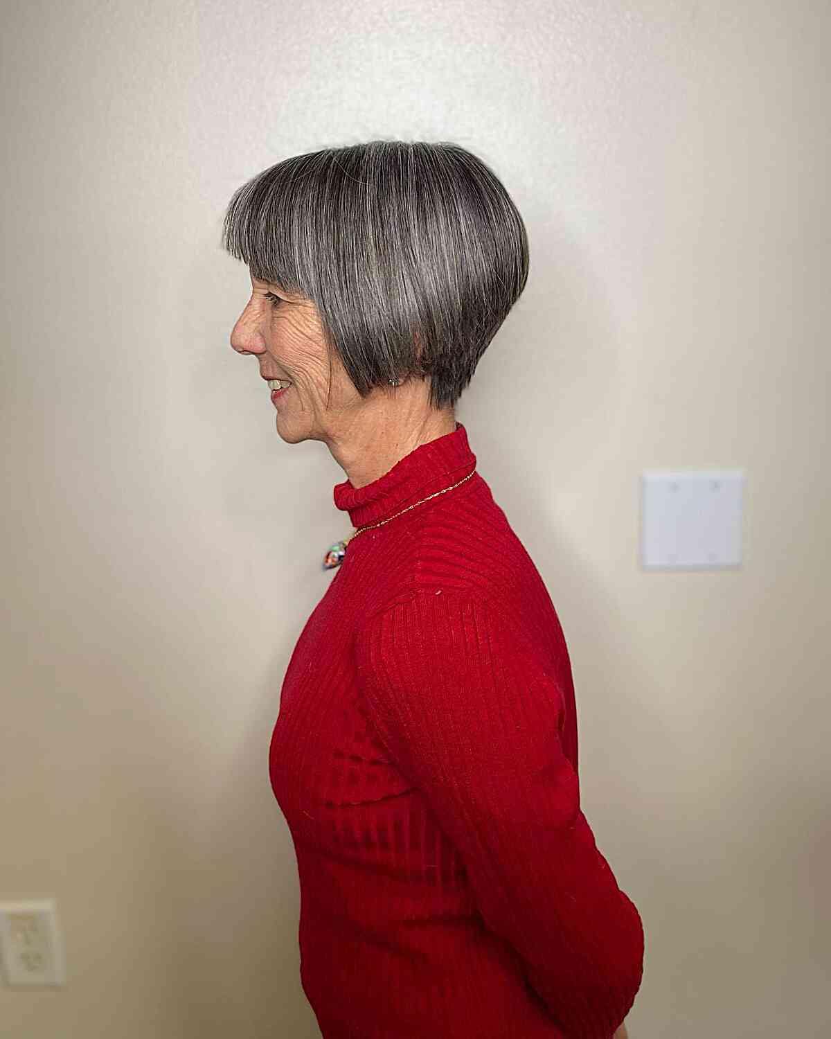 Jaw-Grazing A-Line Pixie Bob with Straight Bangs on Grey-Haired Old Women