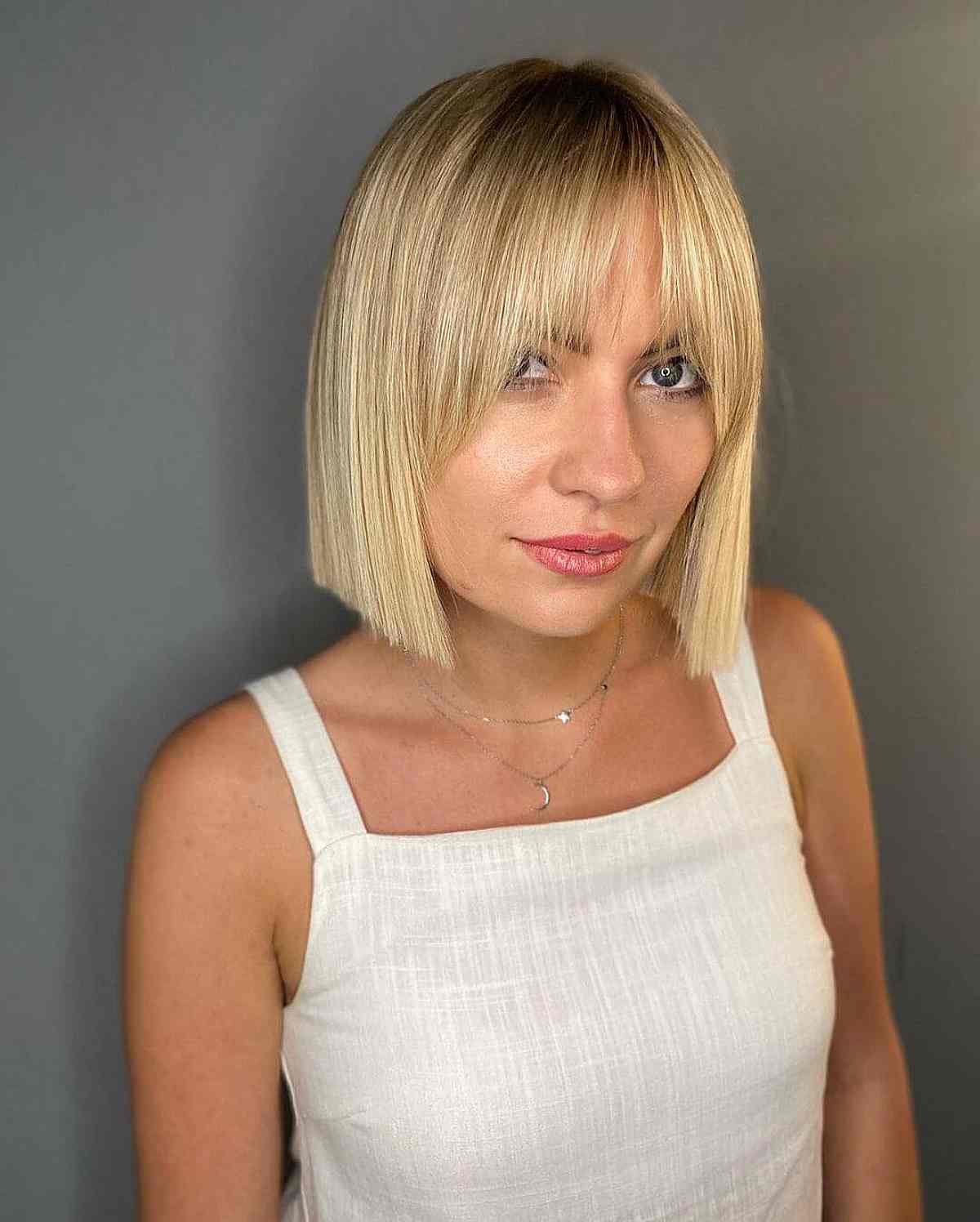 Jaw-Length Blonde Blunt Cut with Bangs