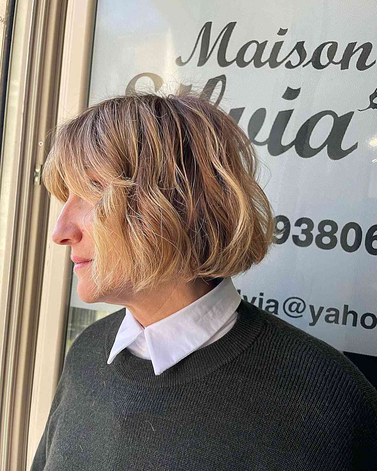 Jaw-Length Blonde Edgy Choppy Bob with Subtle Waves and Bangs