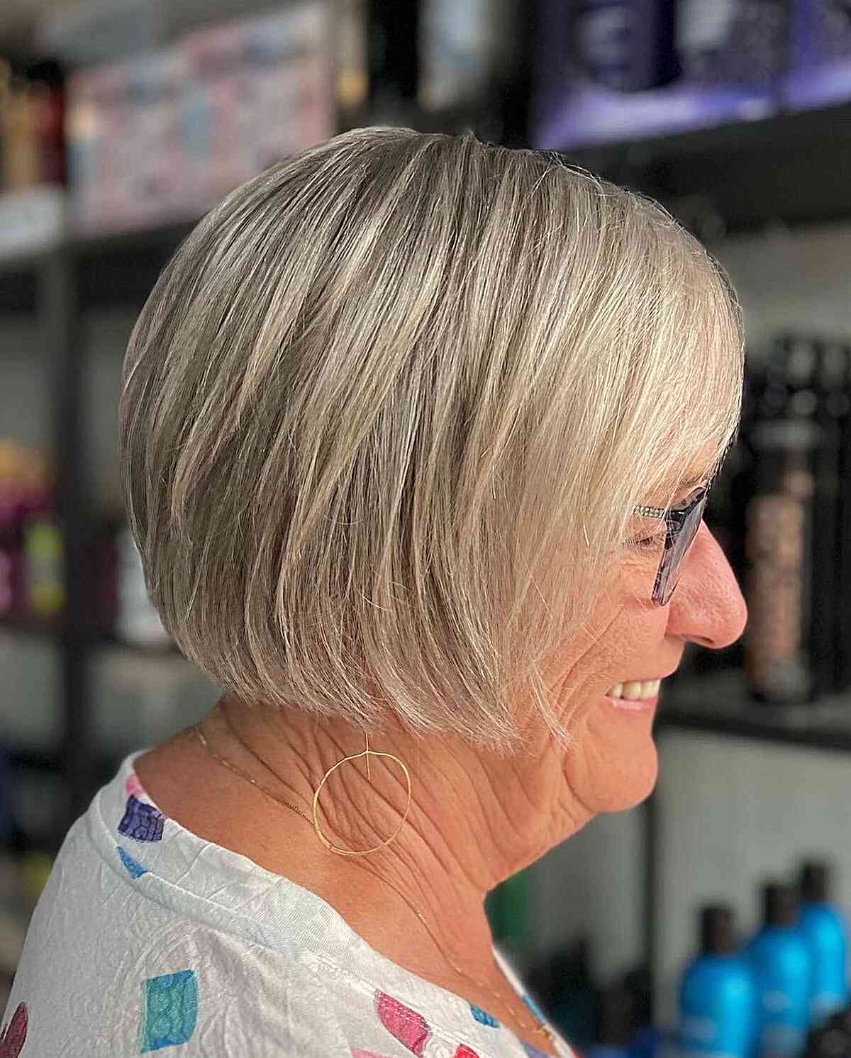 Jaw-length bob hairstyle for straight hair and women over 60 with glasses