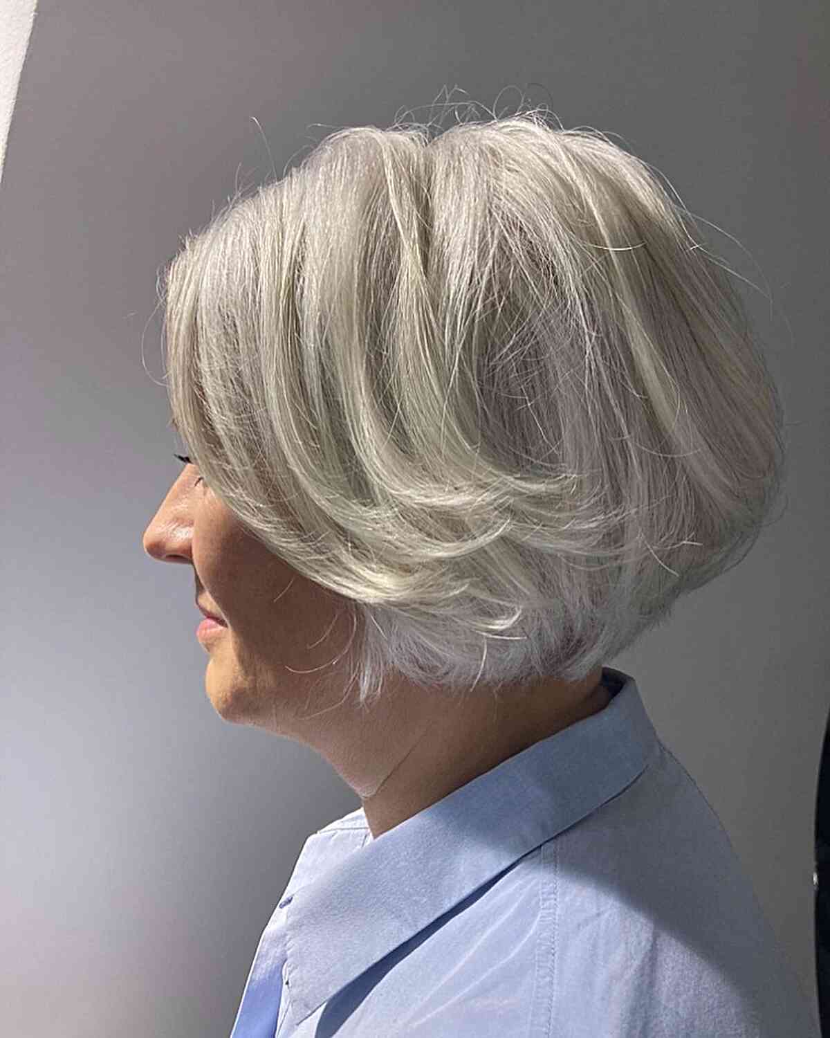 Jaw-Length Fluffy White Bob with Feathered Layers on Older Ladies Over 60