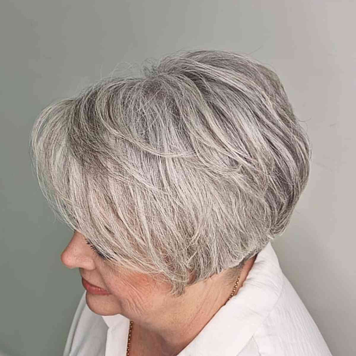 Jaw-Length Grey Layered Pixie Bob with Soft Waves for Older Women