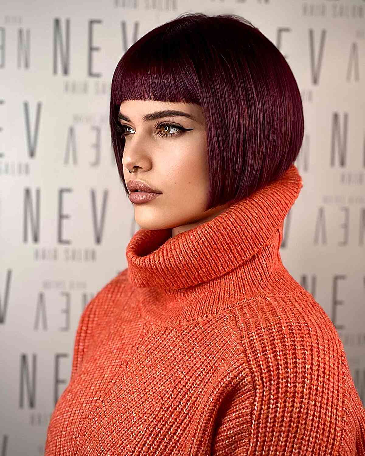 Jaw-Length Maroon Inverted Bob with a Blunt Fringe