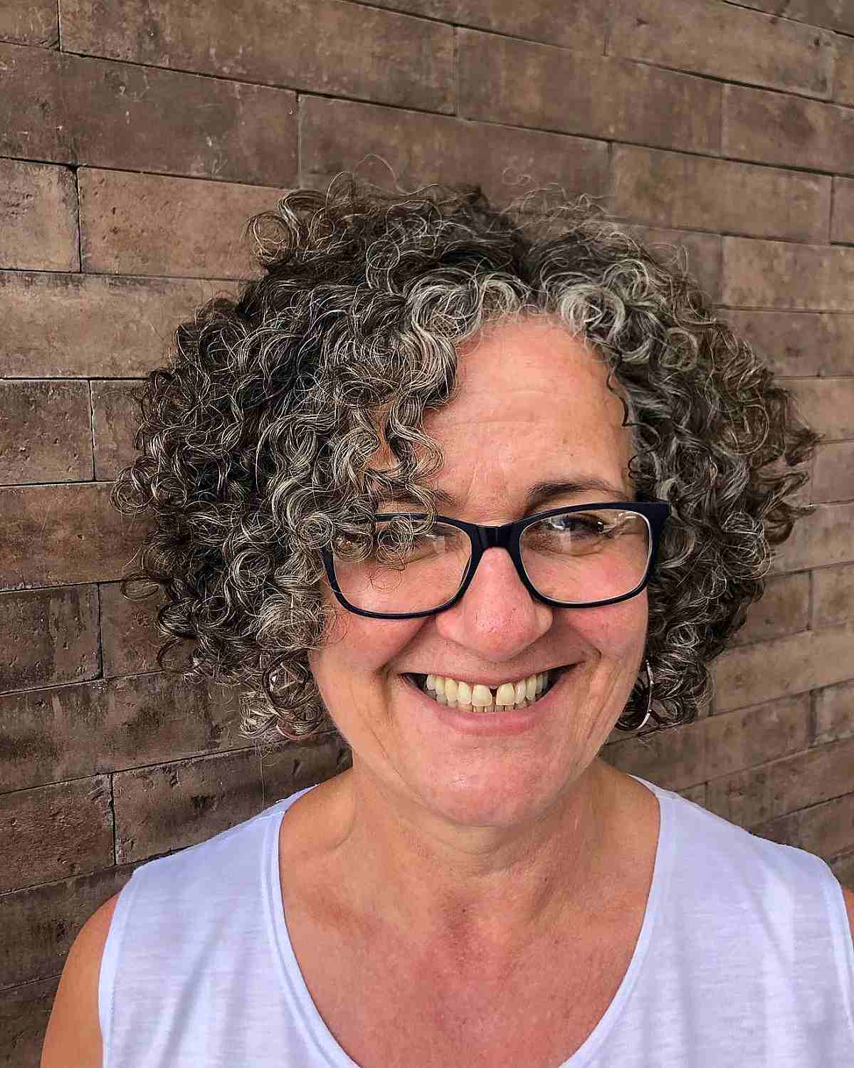 Jaw-Length Soft Tousled Curls and Layers for Older Women with Glasses