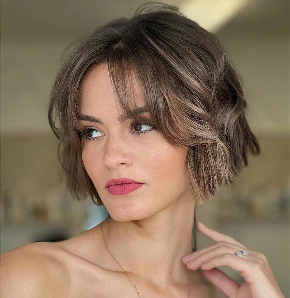 Jaw-Length Textured Hair with Curtain Bangs