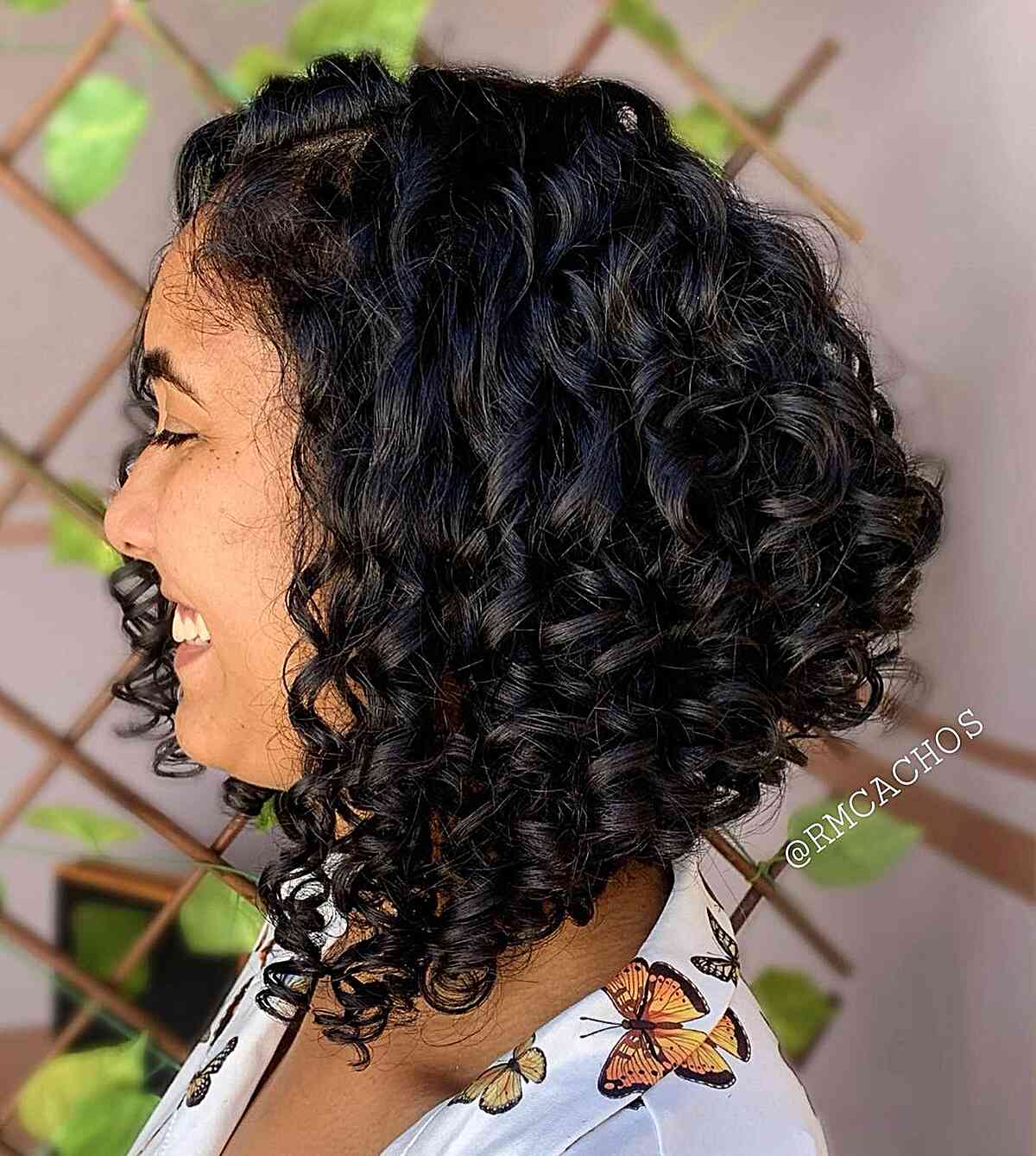 Jet Black Stacked Bob with Voluminous Curls