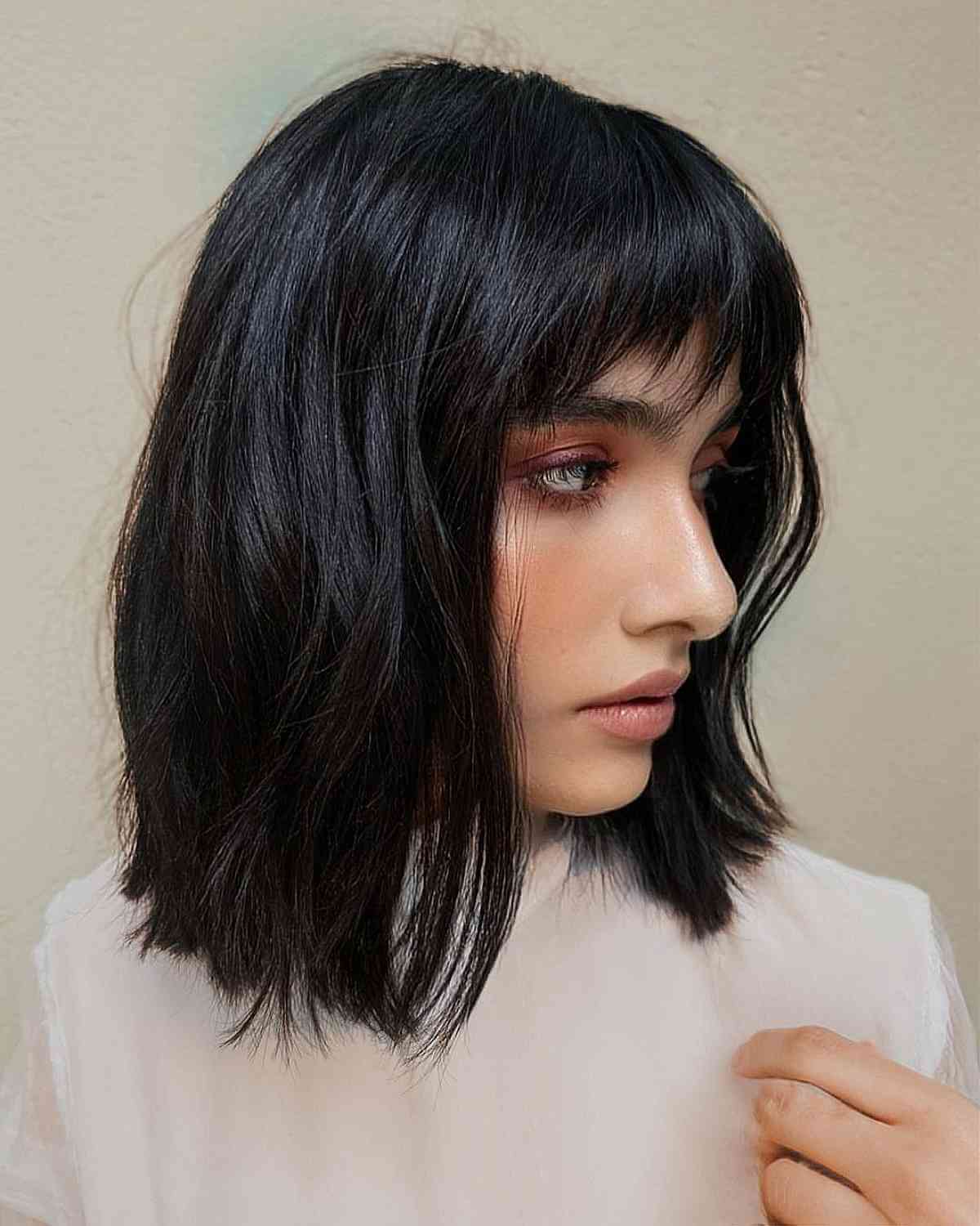 Jet Black Textured Layers and Choppy Bangs