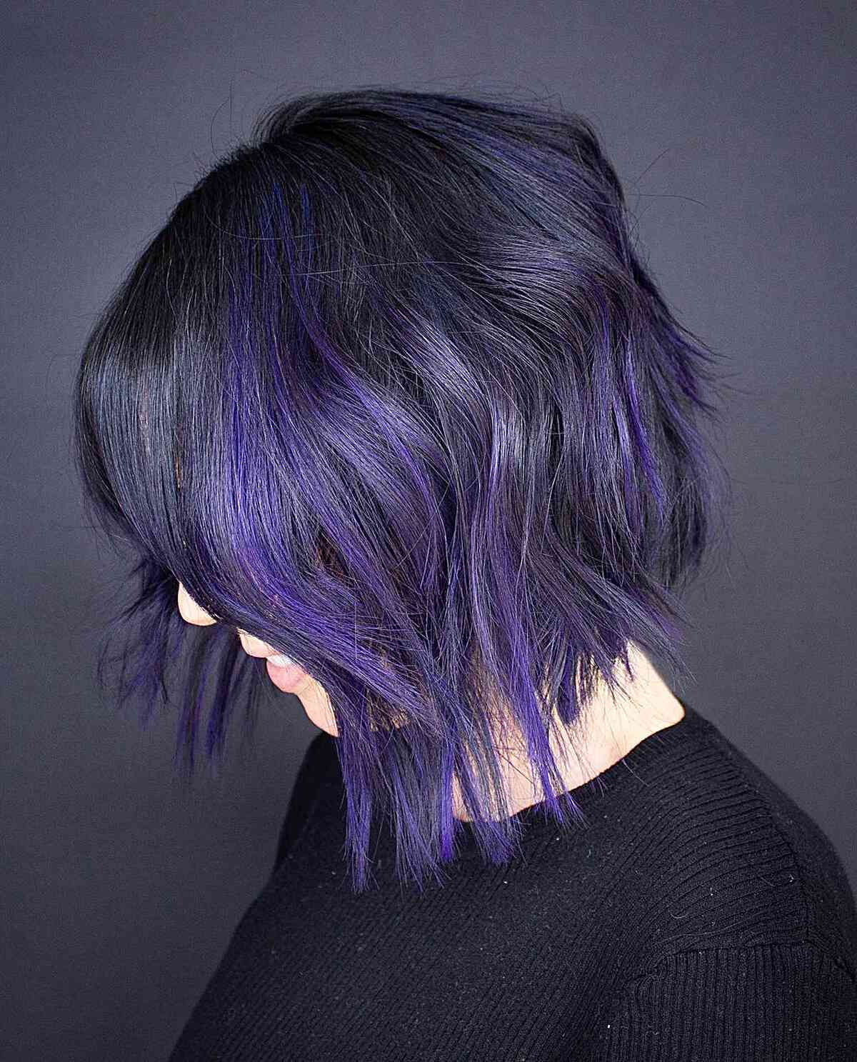 Jet Black with Vivid Purple Highlights for wavy hair