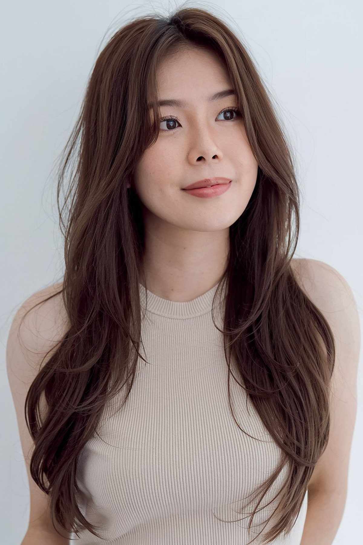 Long Korean-inspired hair with soft layers for asian women