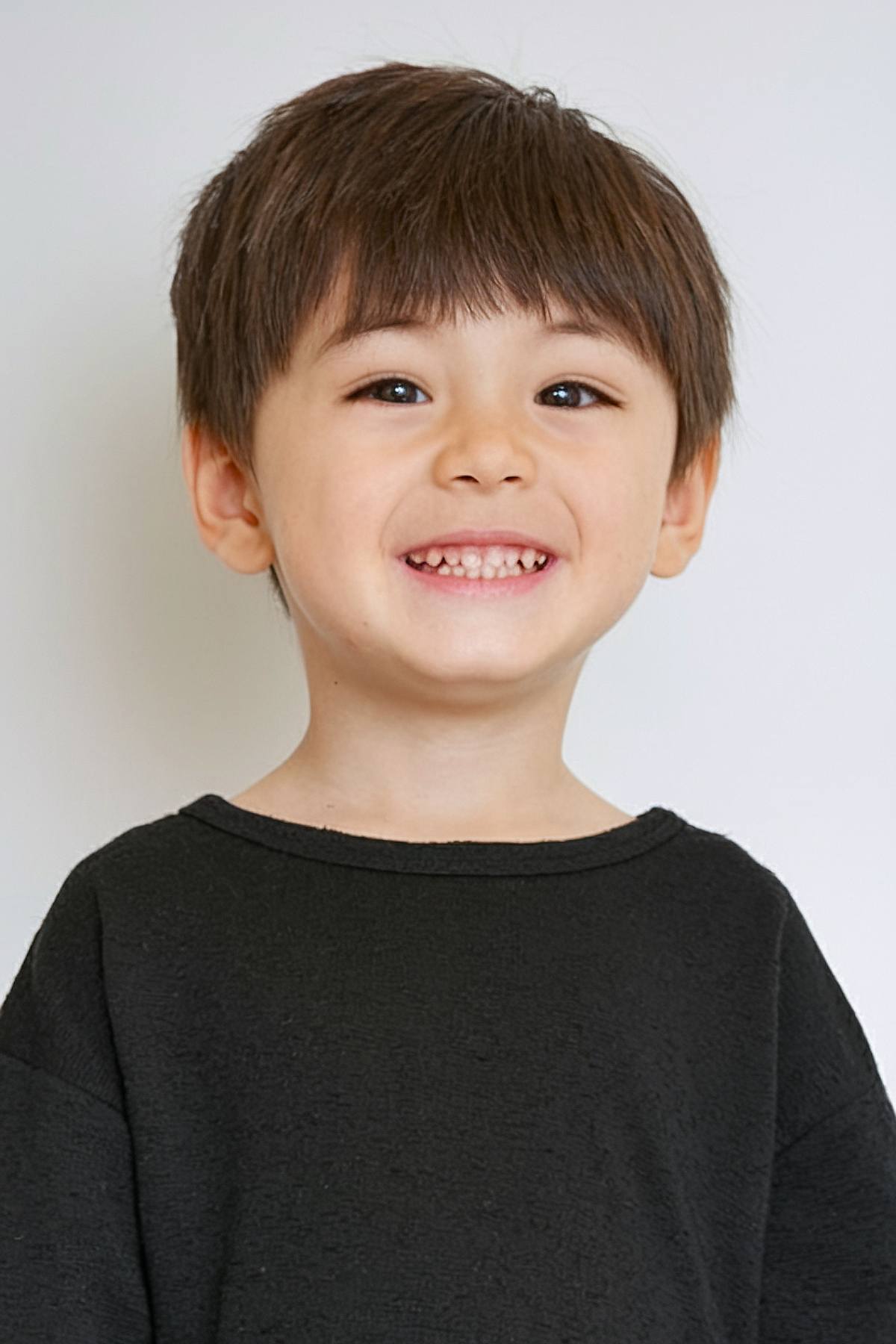 Korean toddler boy haircut with soft bangs and longer top