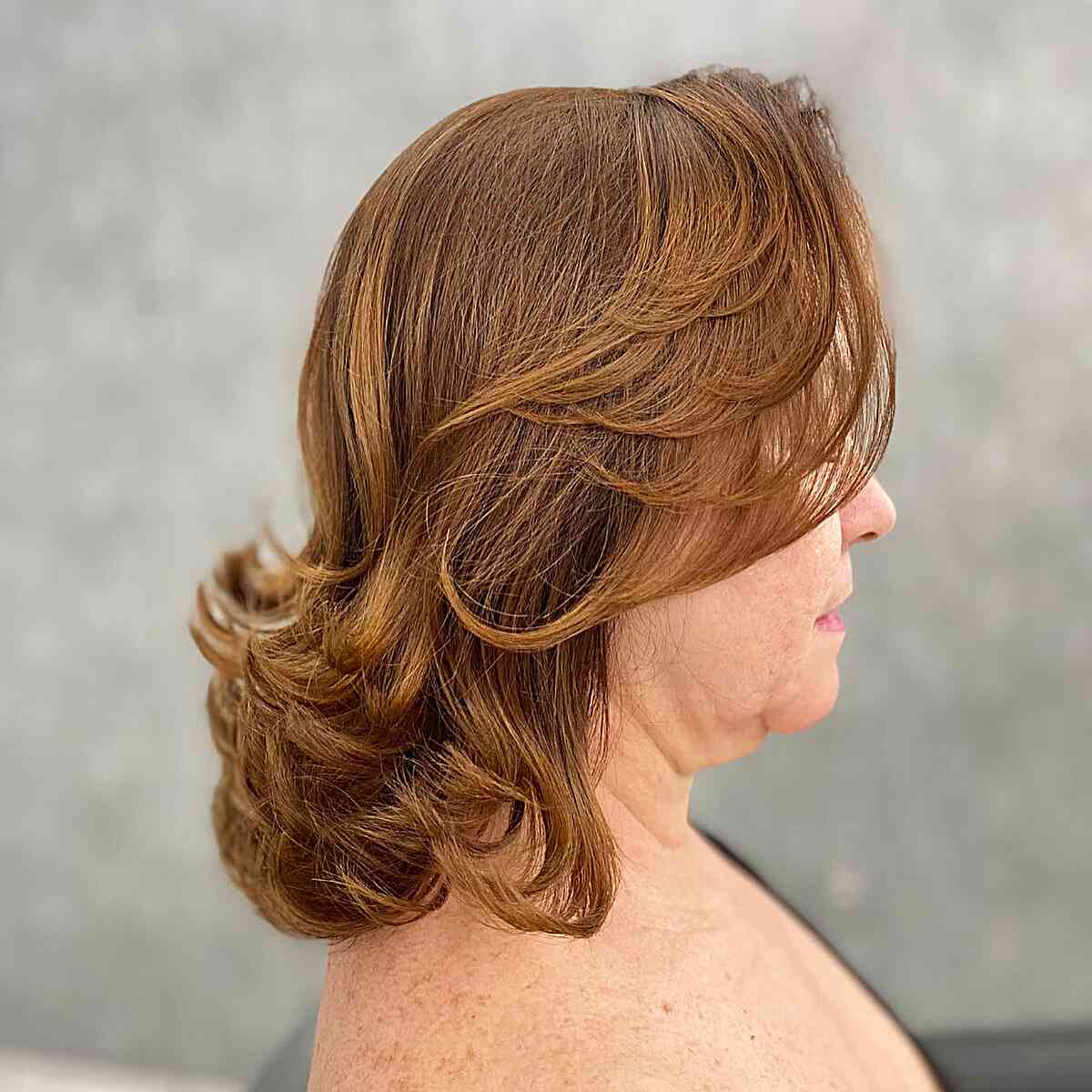 Layered Bangs and Flipped Ends for Overweight Ladies Aged Fifty with Shoulder-Length Hair