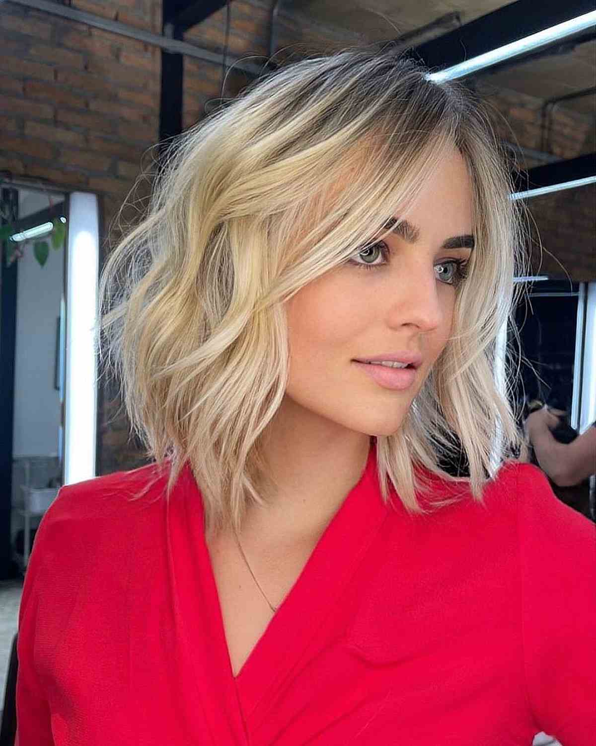 Layered Bob with Beach Waves and Blonde Balayage for Fine Hair