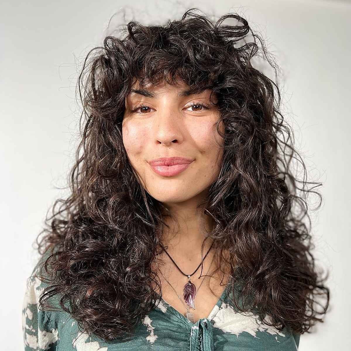 Layered Curls with a Thick, Curly Fringe