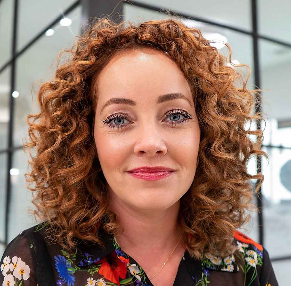 layered curly bob hairstyle with thick curls