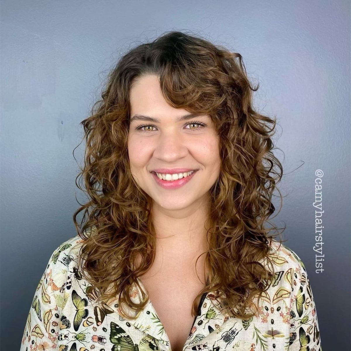 Layered curly locks with side bangs