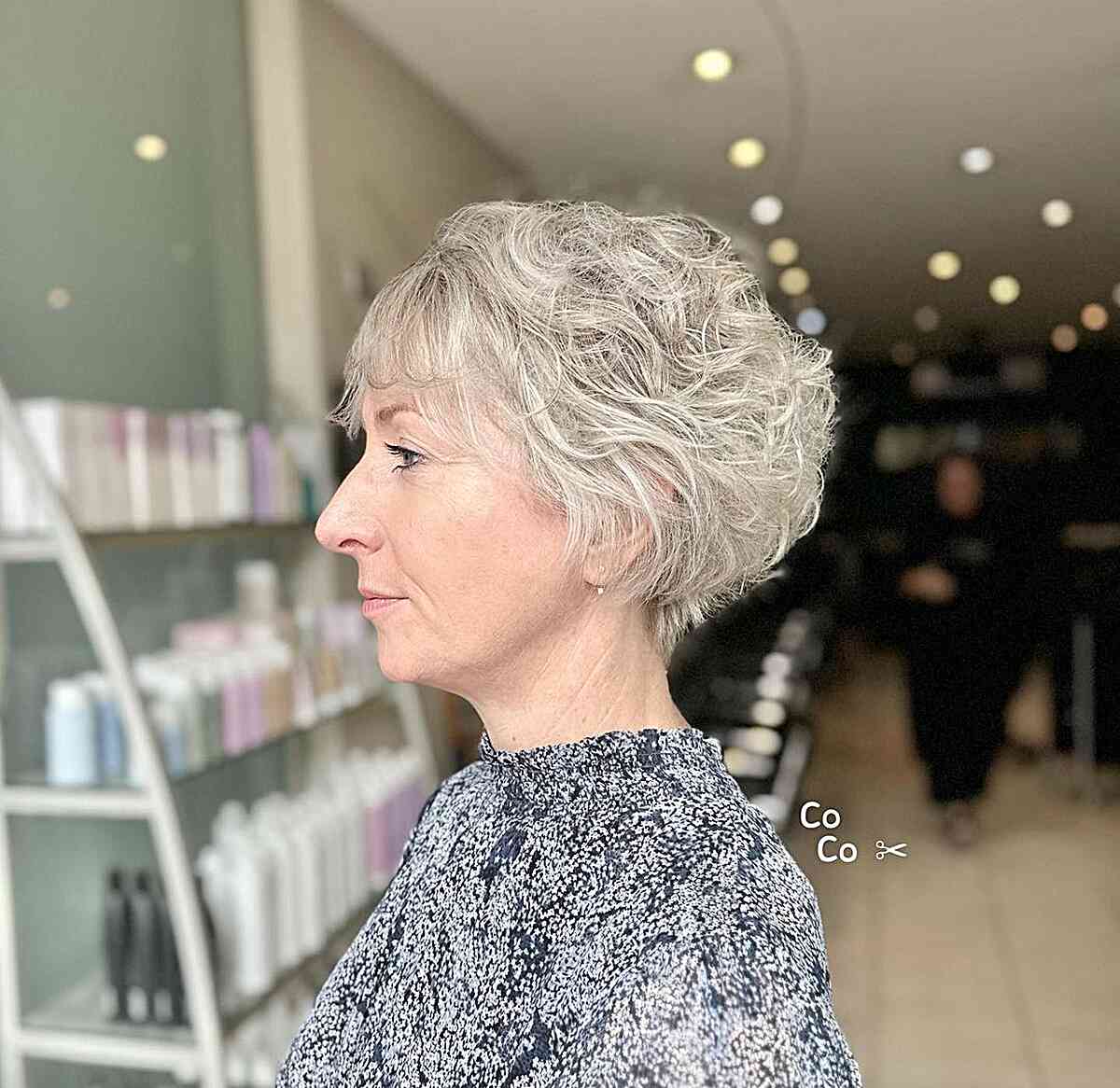 Layered Curly Short Hair with Thin Bangs on Mature Ladies Over Sixty