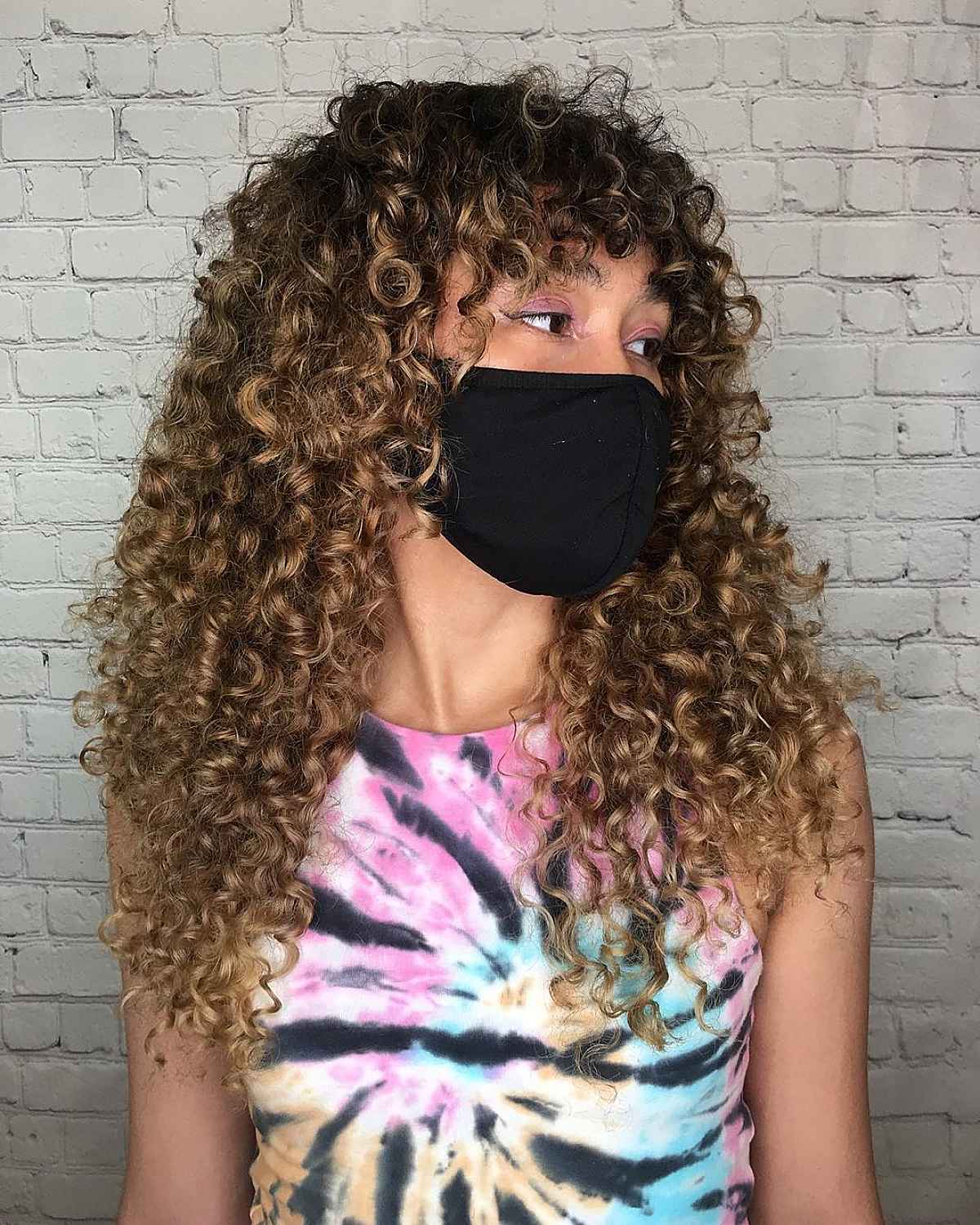 Layered Cut with Bangs for Tight Curls