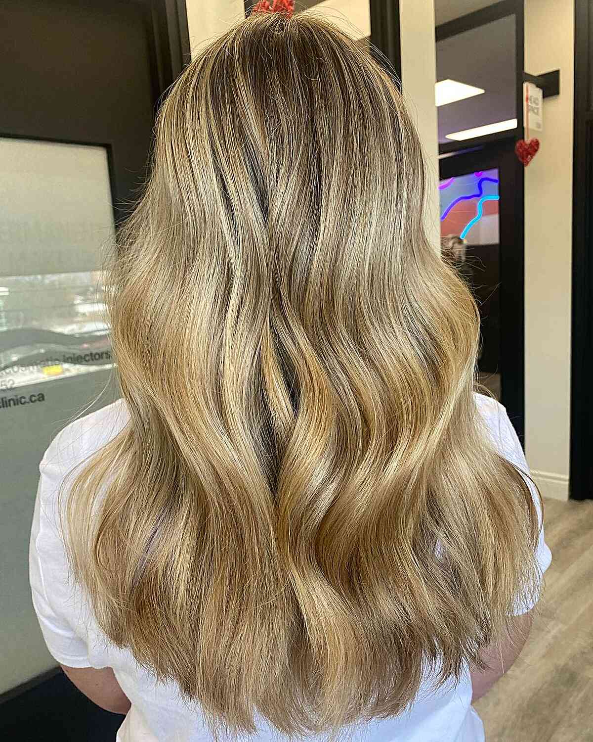 Layered hair with honey blonde balayage highlights