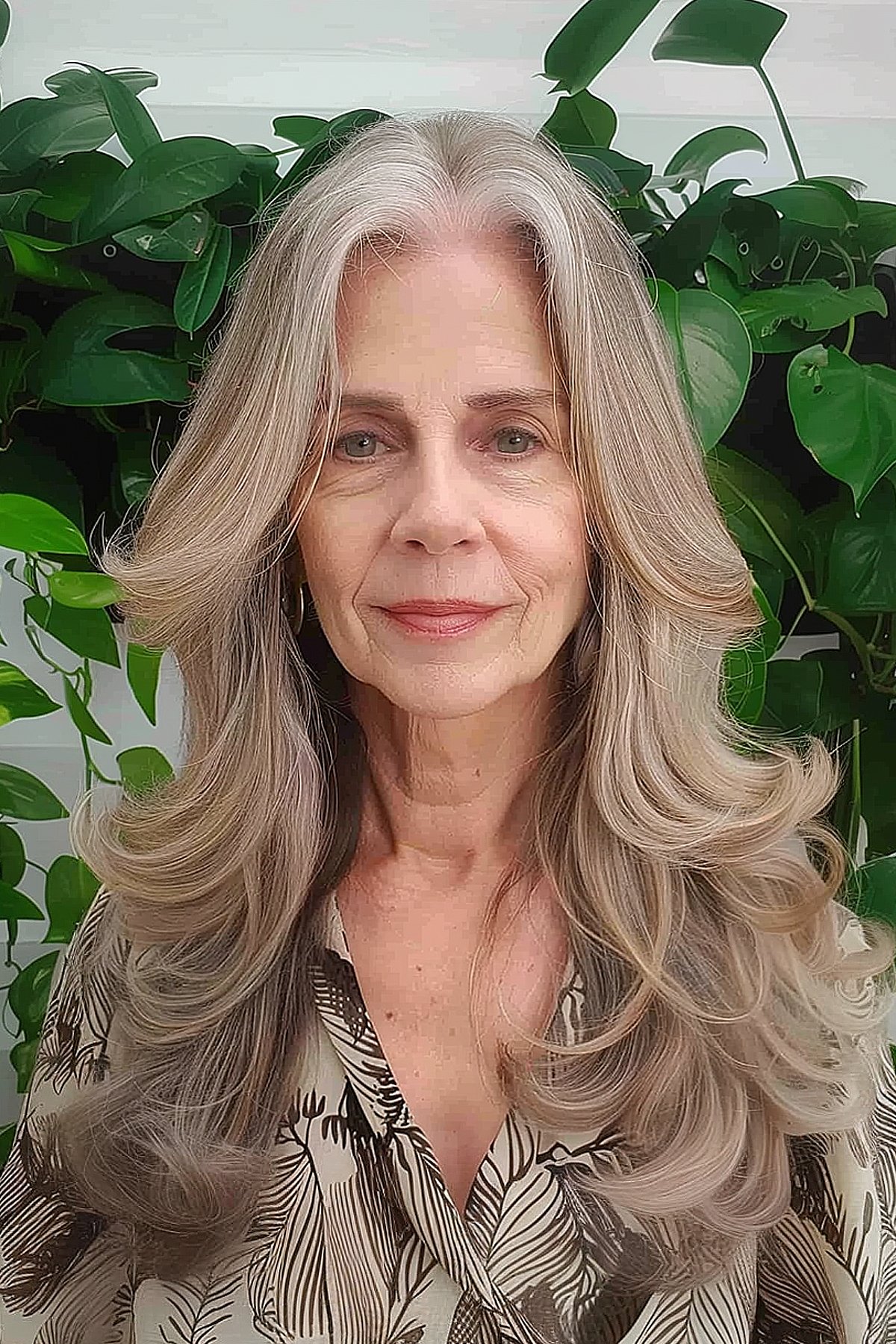 Layered hair with a middle part for women over 60