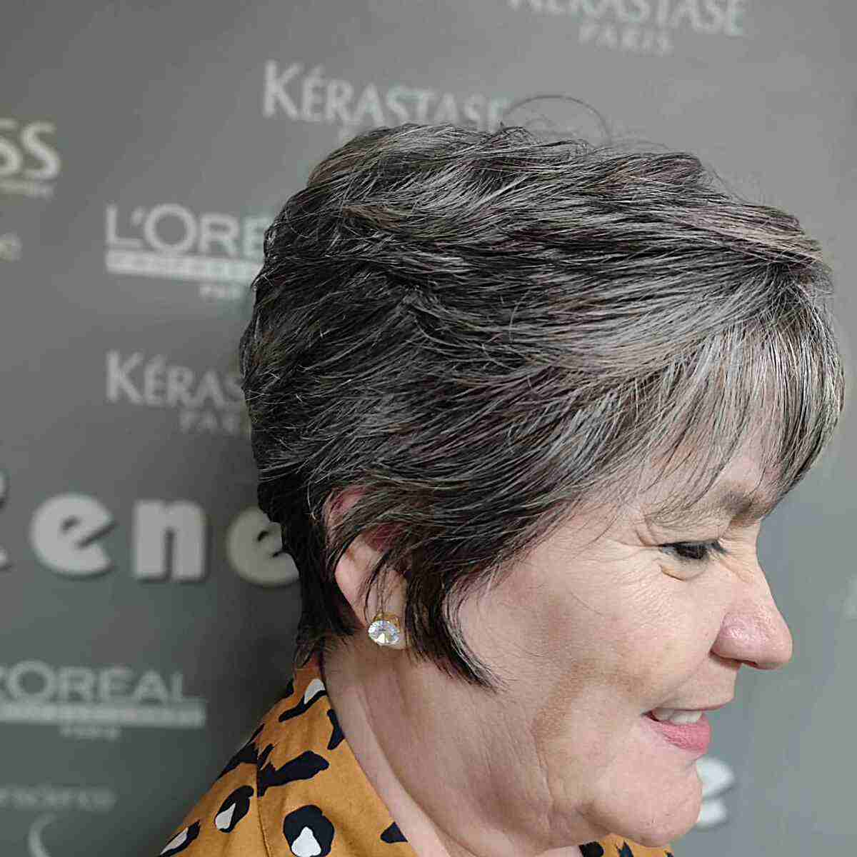Layered Salt-and-Pepper Choppy Pixie Hair with Soft Front Bangs for 60-Year-Old Ladies