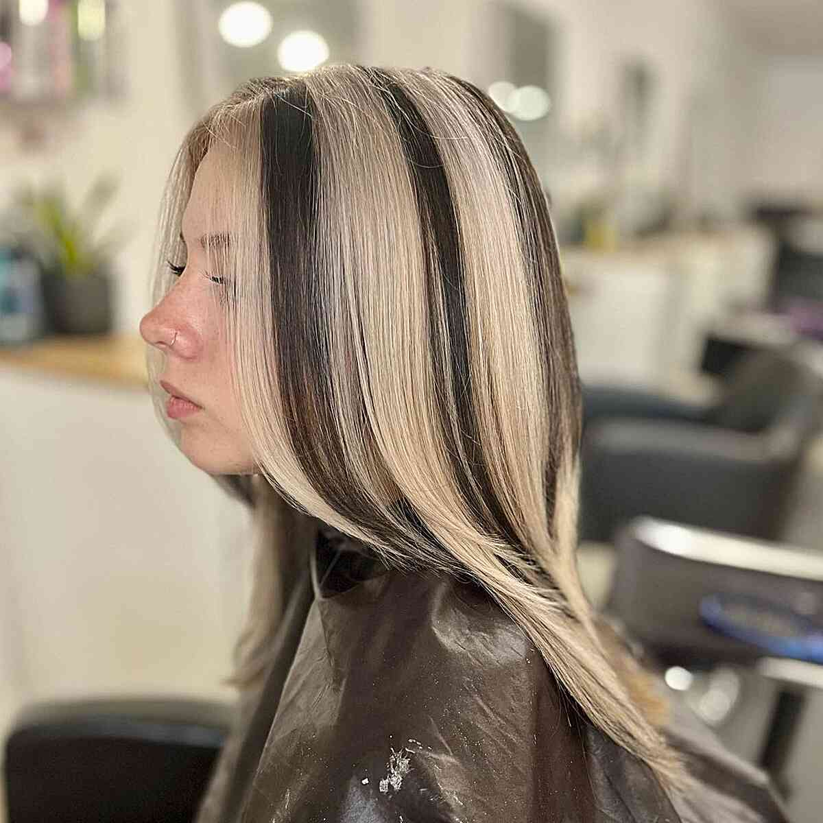 Medium-Length Light Blonde Skunk Stripe Hair with Black Strands