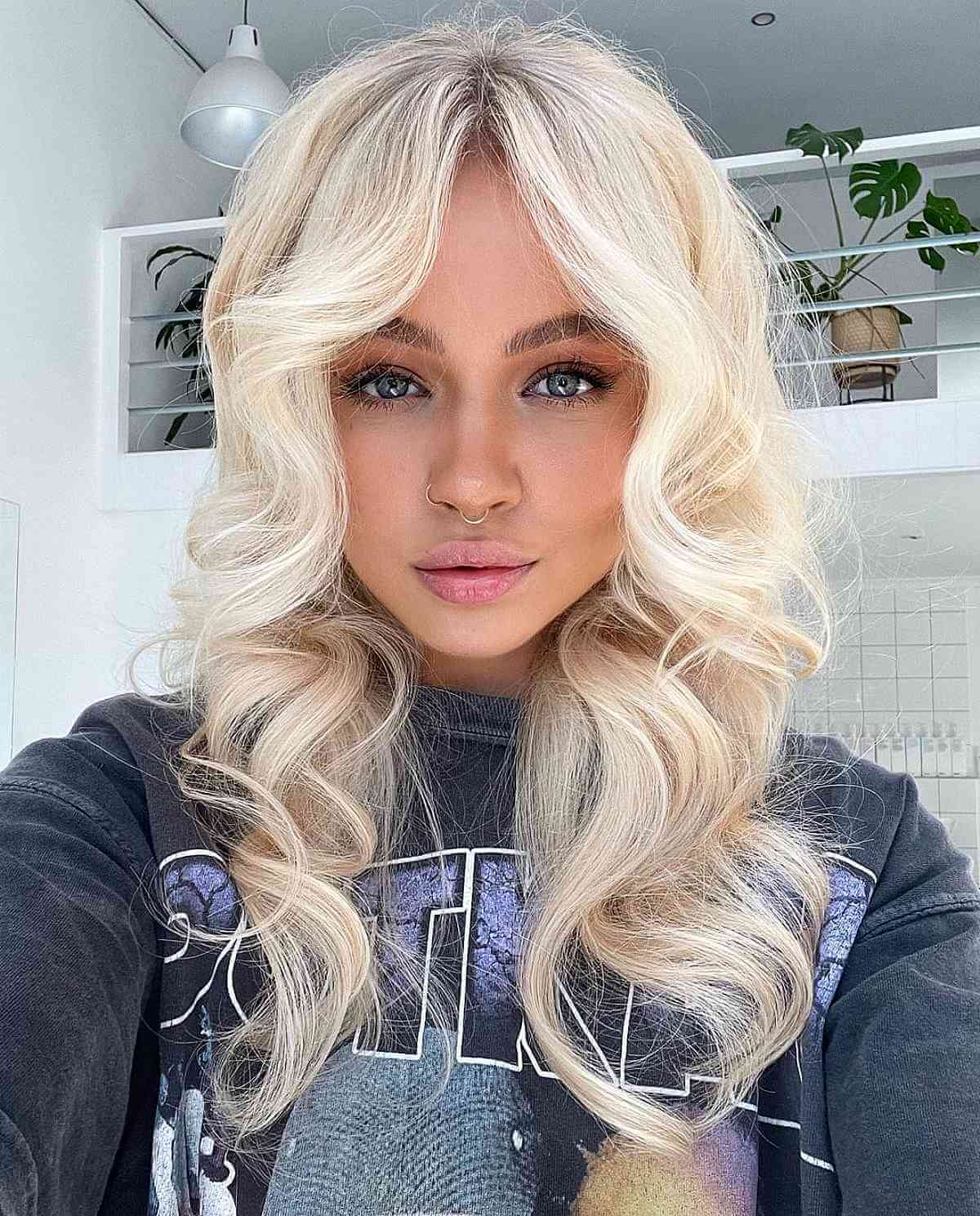 Light Blonde Thick Shag Cut with Middle Part Bangs