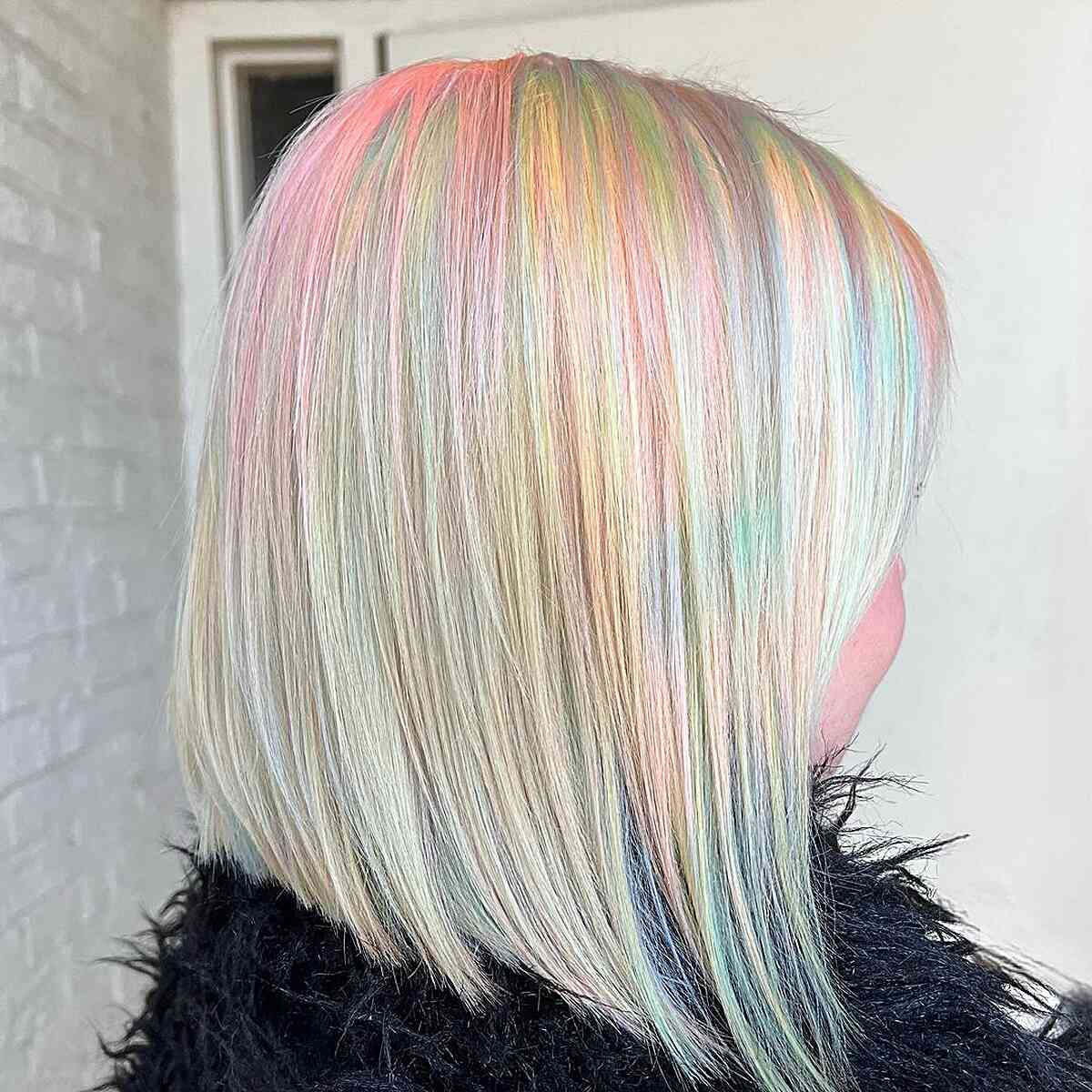 Light Blonde Neck-Length Hair with Hints of Cotton Candy Pink and Green