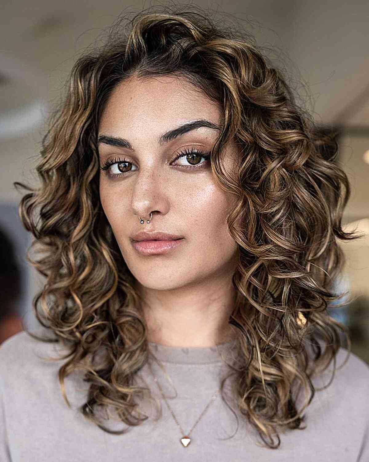 Light Brown Curls with Highlights and Layers