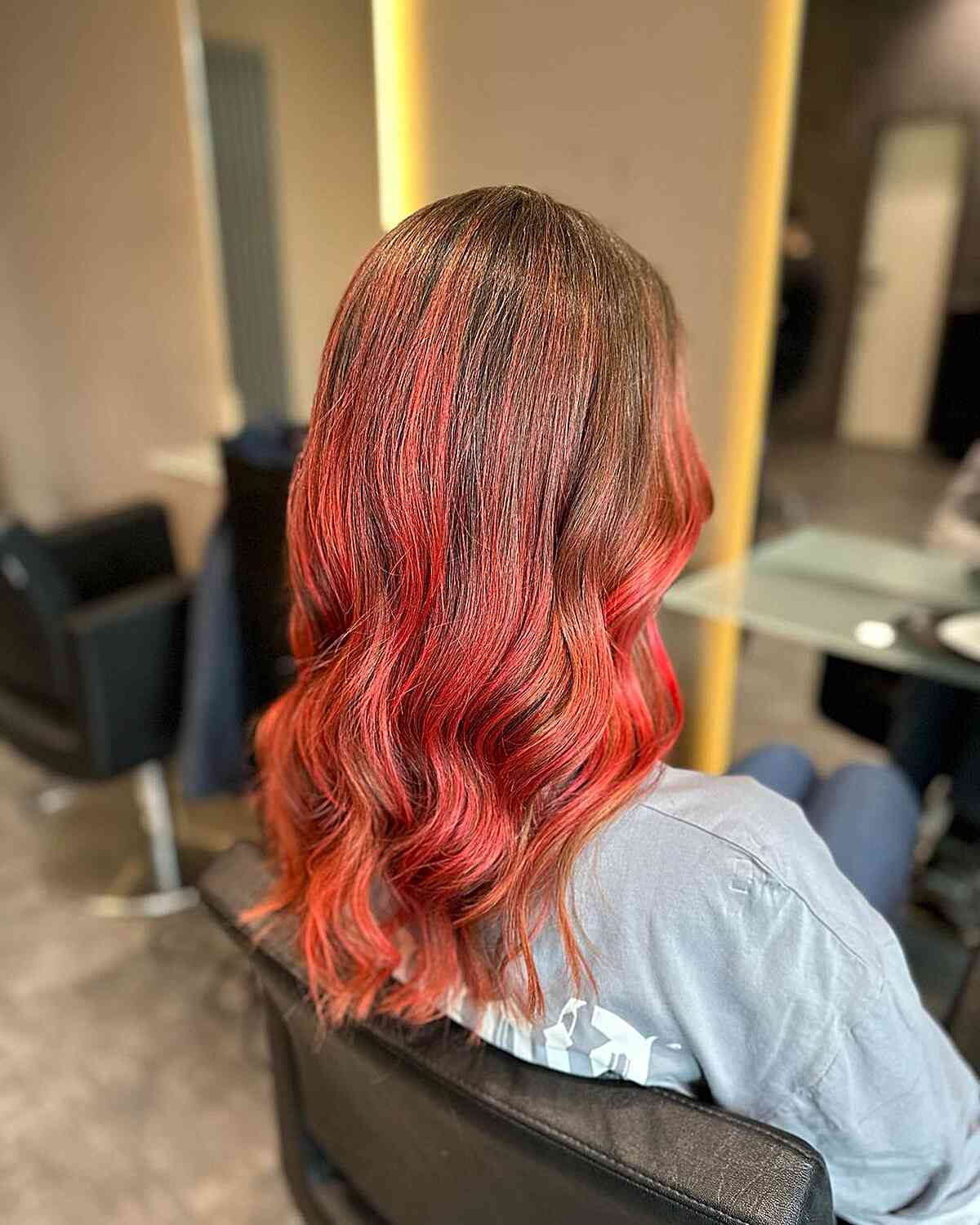 Medium-Length Light Brown Hair with Bright Red Balayage Highlights
