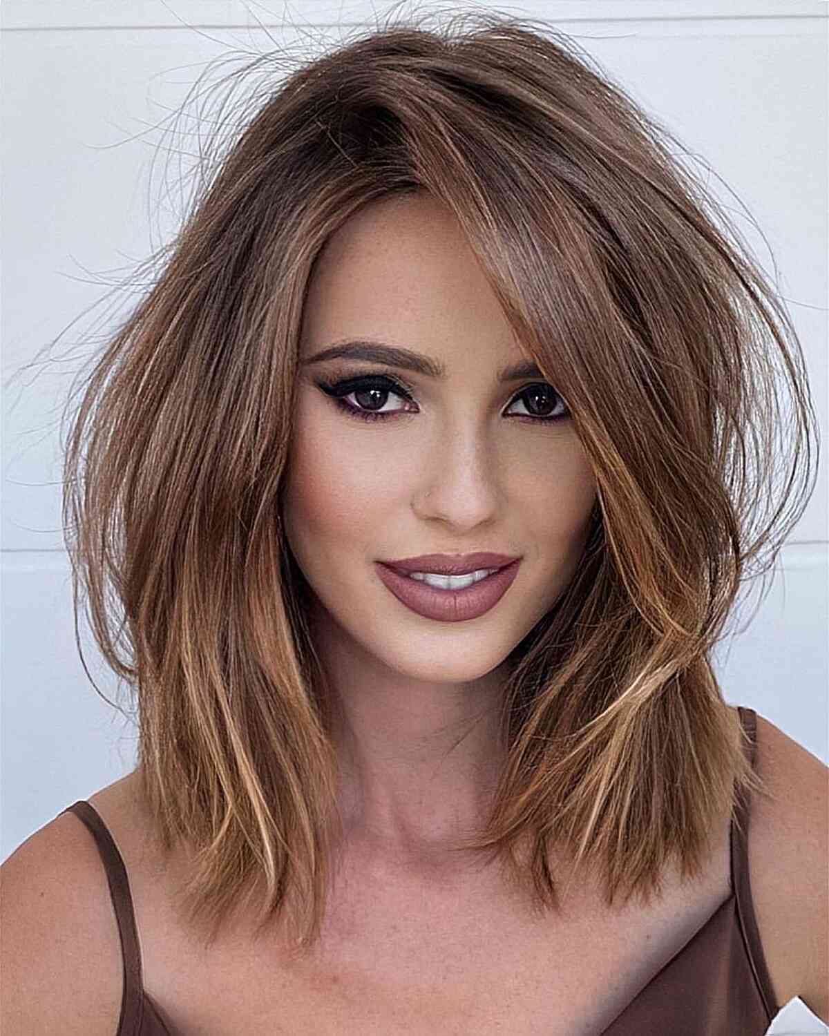 Light Brown Side-Parted Medium-Length Straight Hair with Layers and Highlights