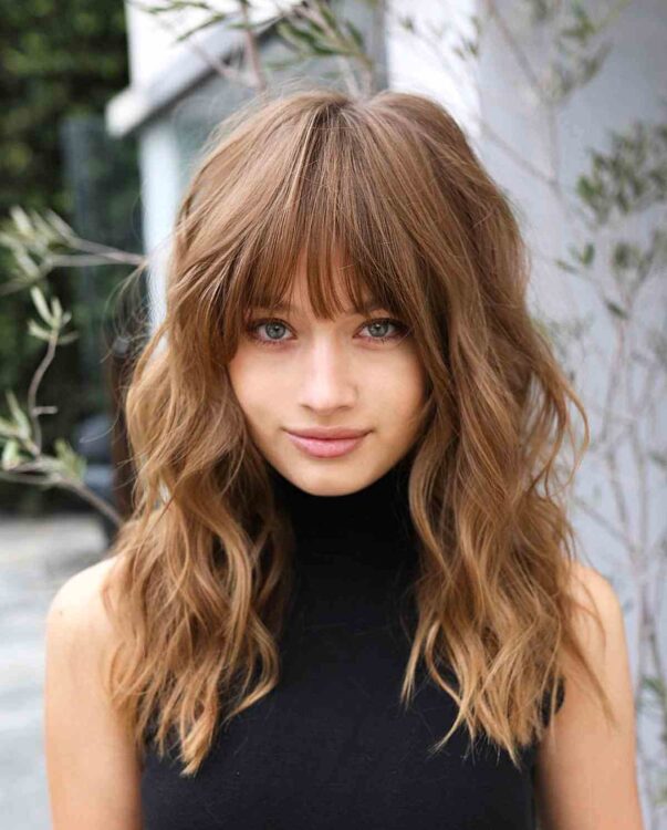 32 Ways to Pair Wavy Hair with Bangs for a Super-Flattering Look