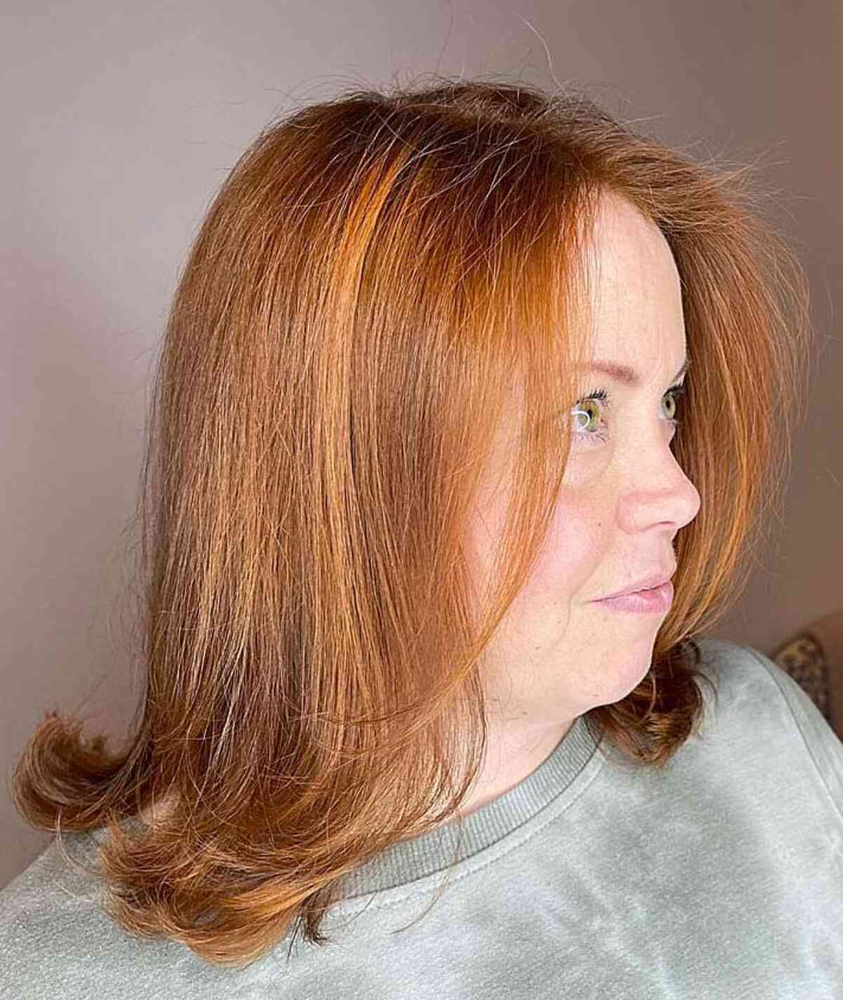 Mid-Length Light Copper Hair with Feathered Ends for Mature Women Over Sixty