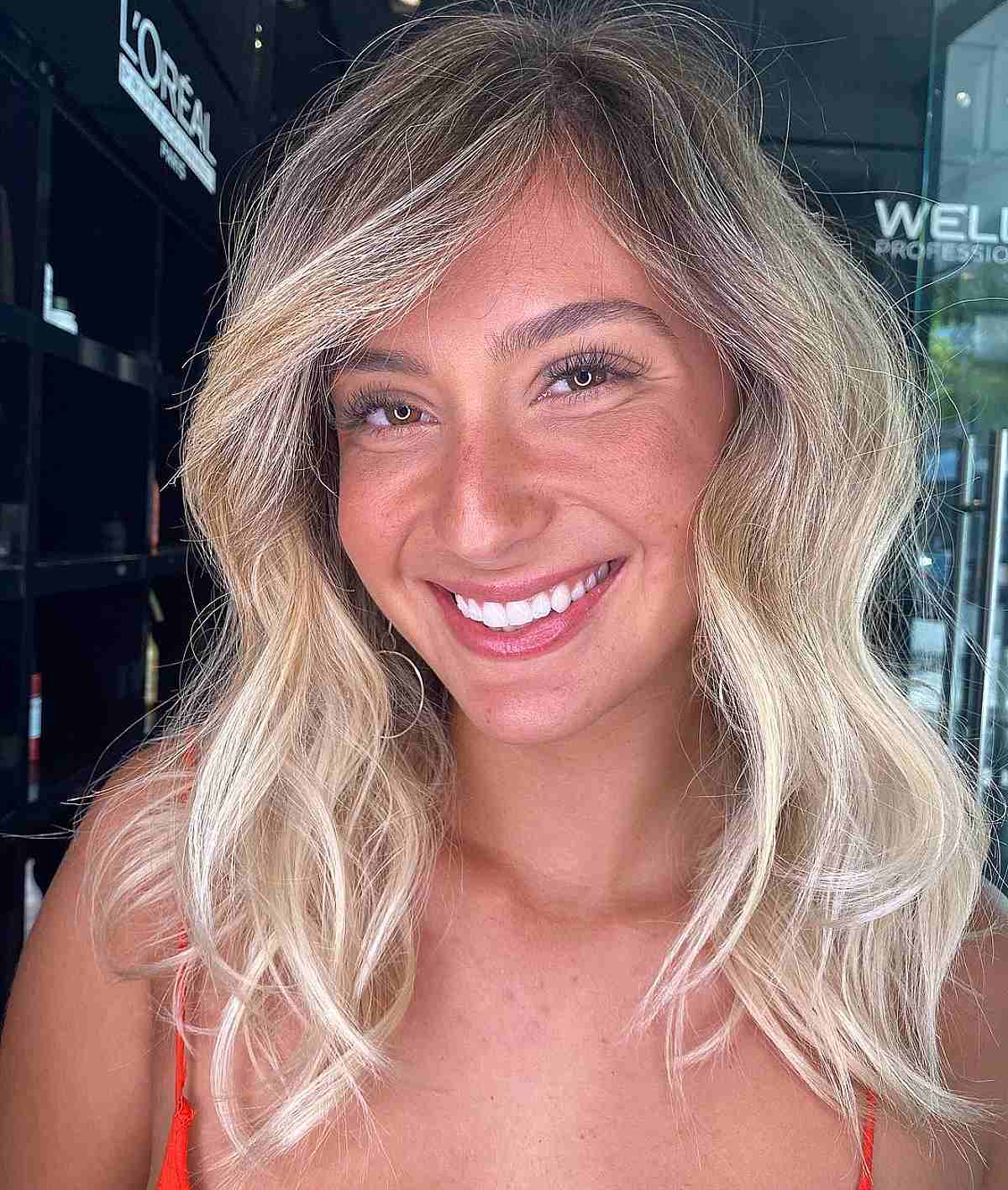 Light Layers and Side-Swept Bangs in Mid-Length Hairstyle for Thin Hair