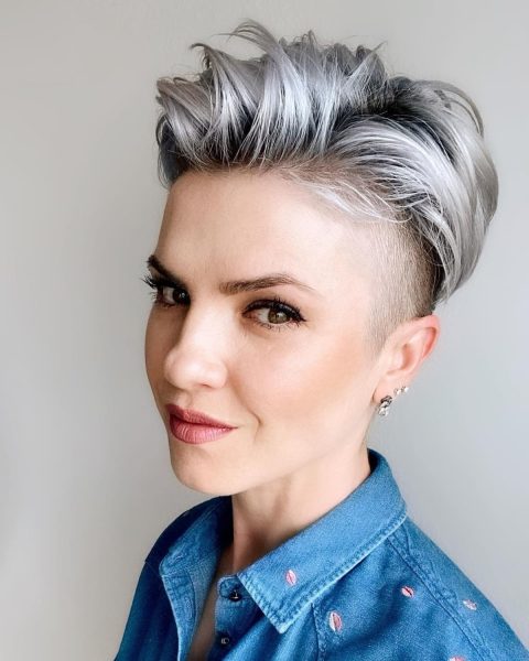 A Light platinum blonde balayage pixie with deep roots