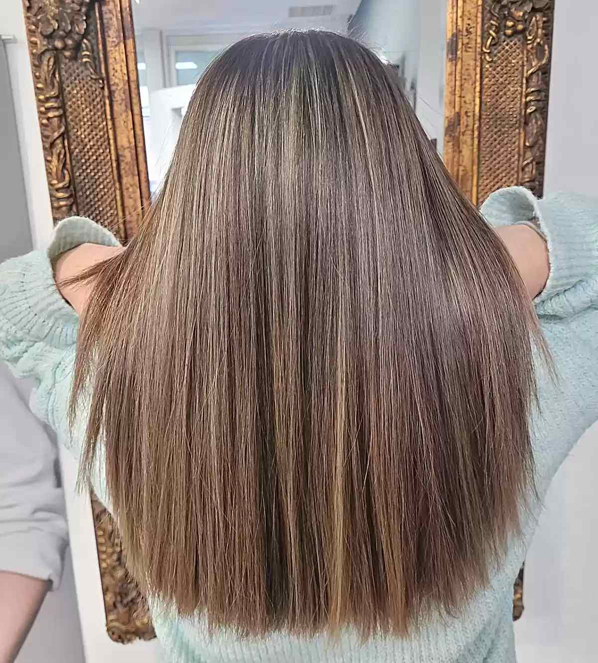 Light Sandy Brown with Subtle Blonde Highlights on Long Straight Hair