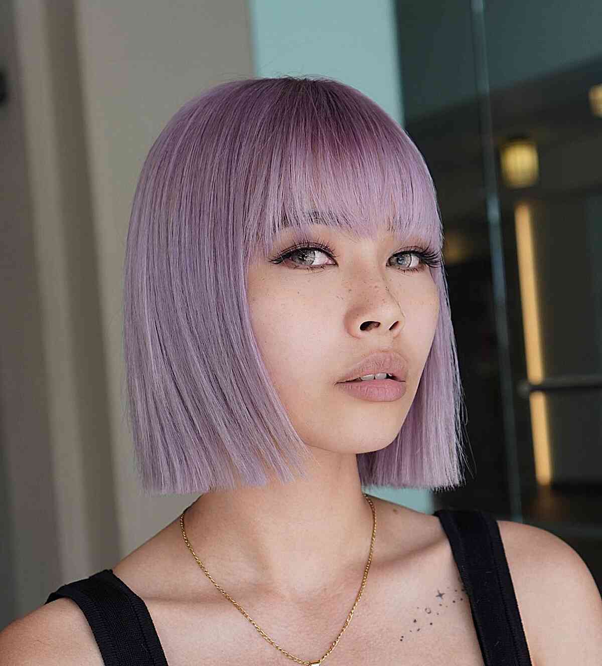 Lilac One-Length Bob for women with wispy bangs and thin hair