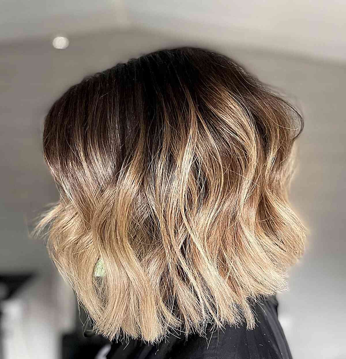 Lived-in Blonde with Dark Roots Balayage for a Short Brown Bob