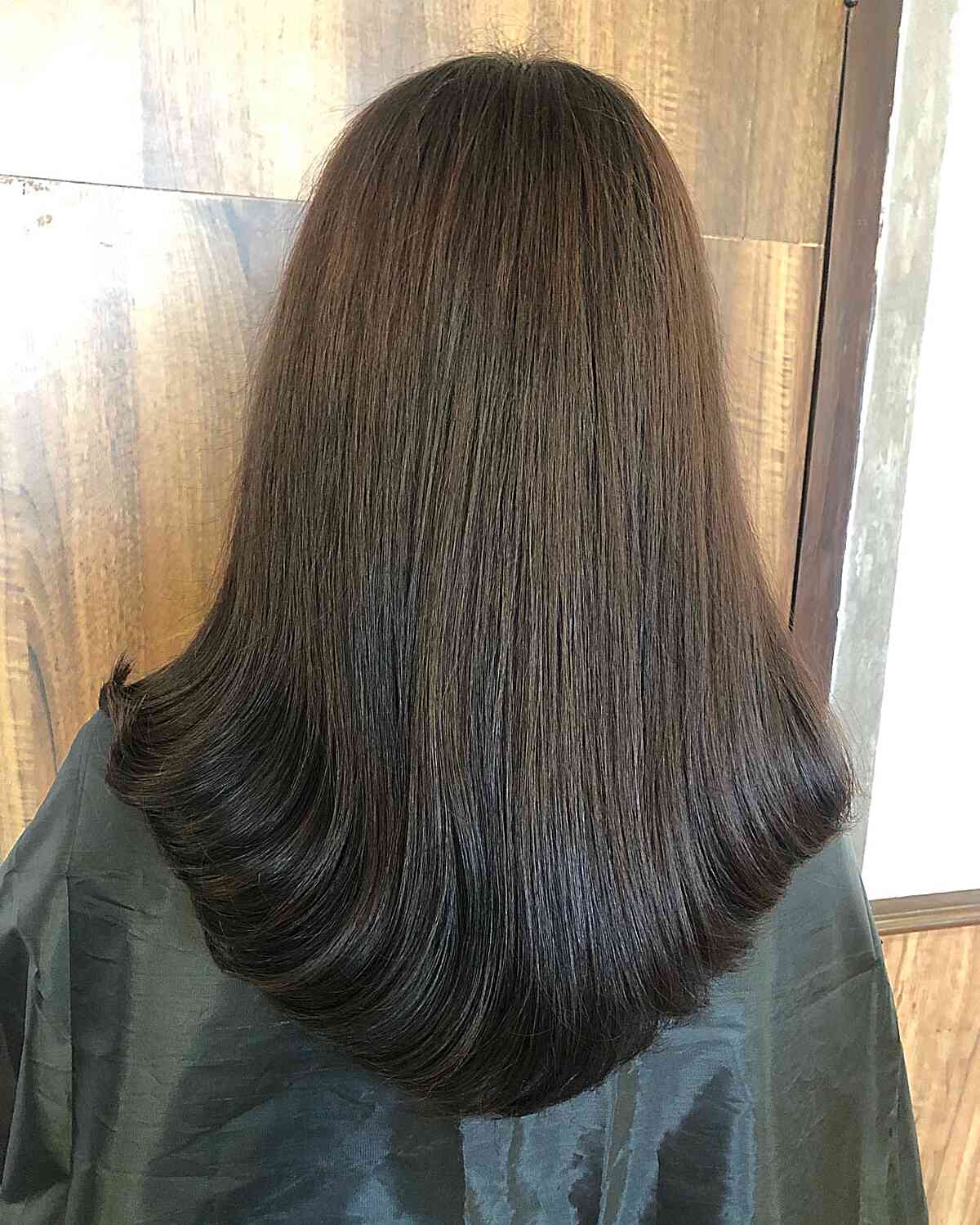 Long and Sleek V-Cut Brunette Hair with Black Ends and Swoopy Ends