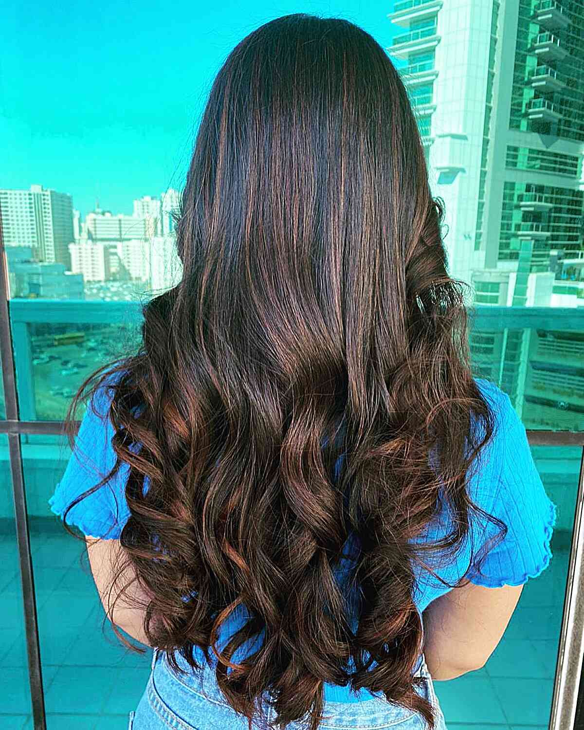 Long Black Hair with Brown Balayage Accents and Soft Curls